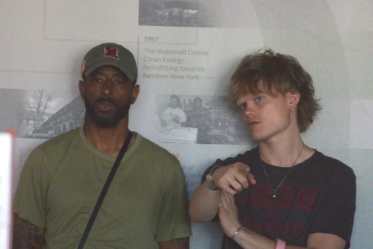 Discussion between Kevin Jones and Adler Dills over the placement of student work