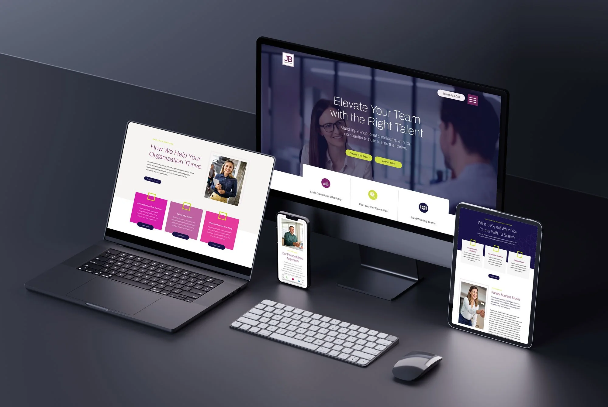 Desktop computer, laptop, tablet, smartphone, keyboard, and mouse on a dark desk displaying business website and presentation.