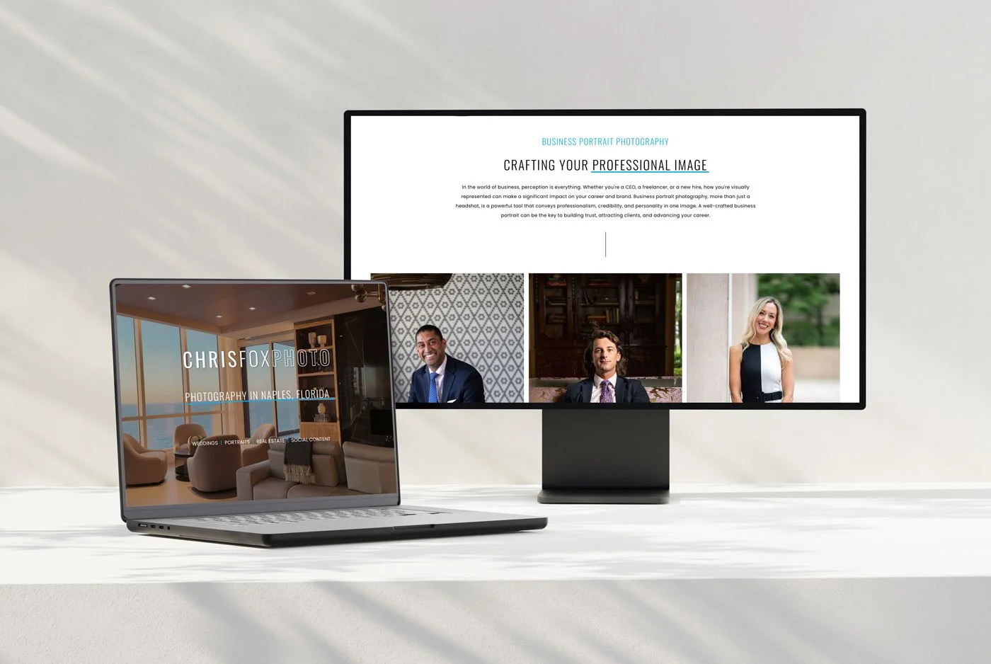 Laptop displaying photography website with images of two men and one woman, and a monitor showing a professional profile page for a business portrait photography service.
