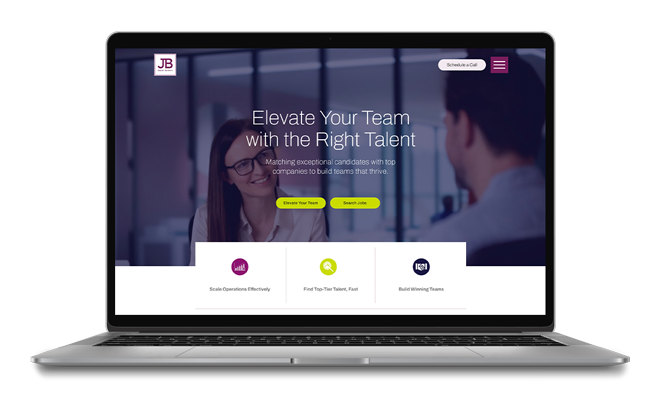Laptop displaying a webpage with a business recruitment theme. The page has the headline 'Elevate Your Team with the Right Talent' and buttons labeled 'Elevate Your Team' and 'Search Jobs.' There are icons below for 'Scale Operations Effectively,' 'Find Top-Tier Talent,' and 'Build Winning Teams.' The background shows a blurred office scene with two professionals engaged in conversation.