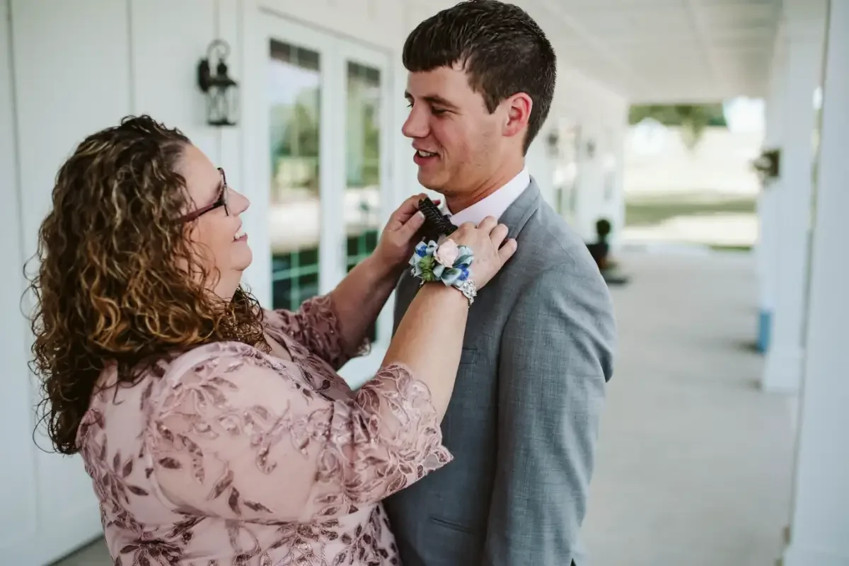 mother-son-moment-wedding-day-portrait-sycamore-tree-floralstories.webp