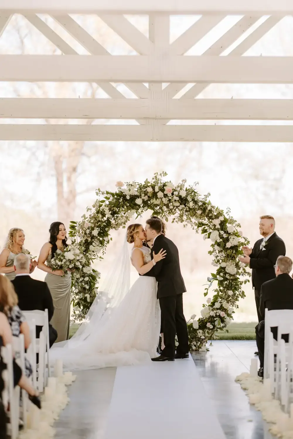 emotional-first-kiss-ceremony-floral-ring-arch-emerson-fields-floral-stories.webp