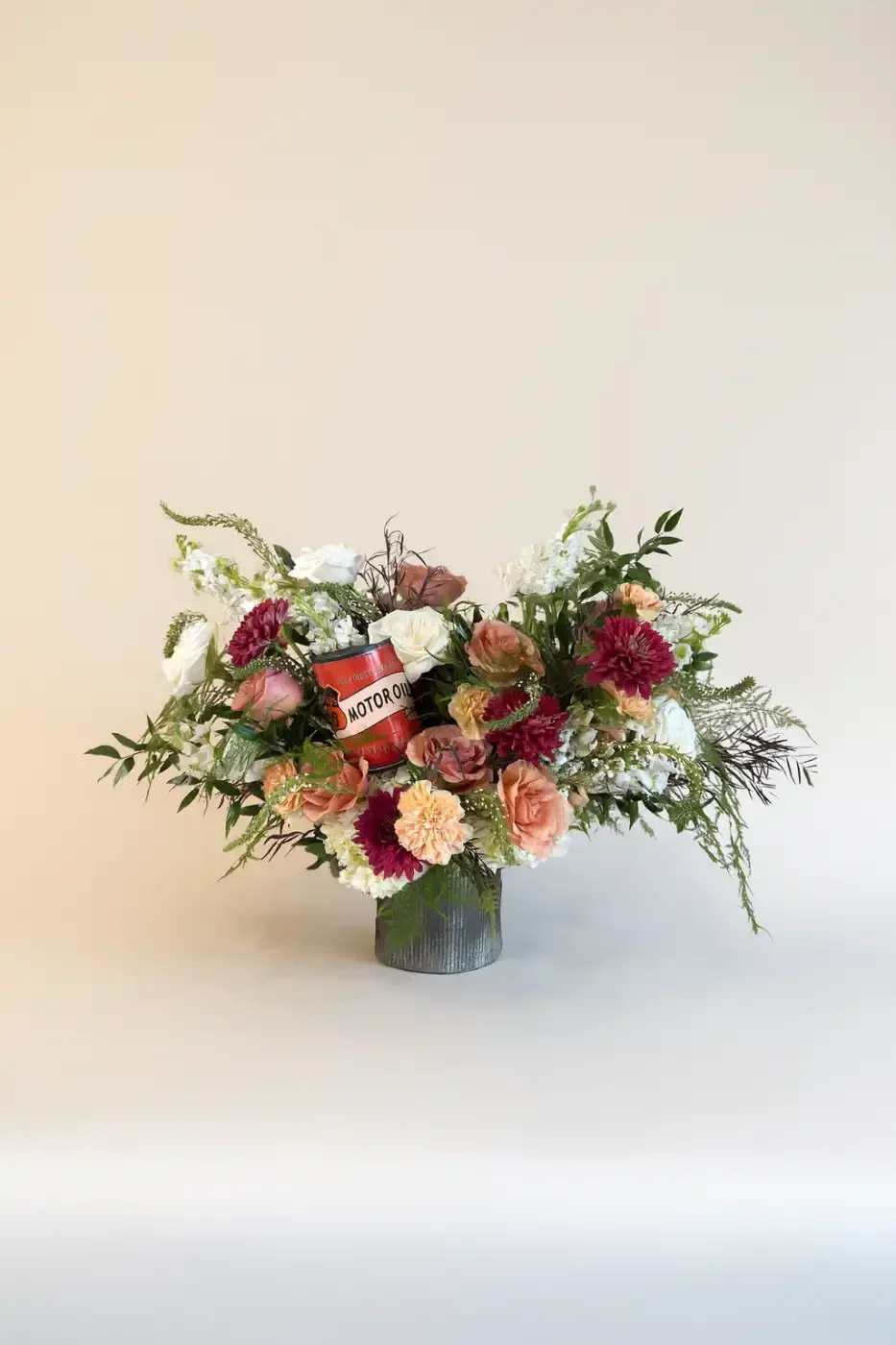 rustic-masculine-sympathy-vase-arrangement-with-motor-oil-detail-floral-stories.webp