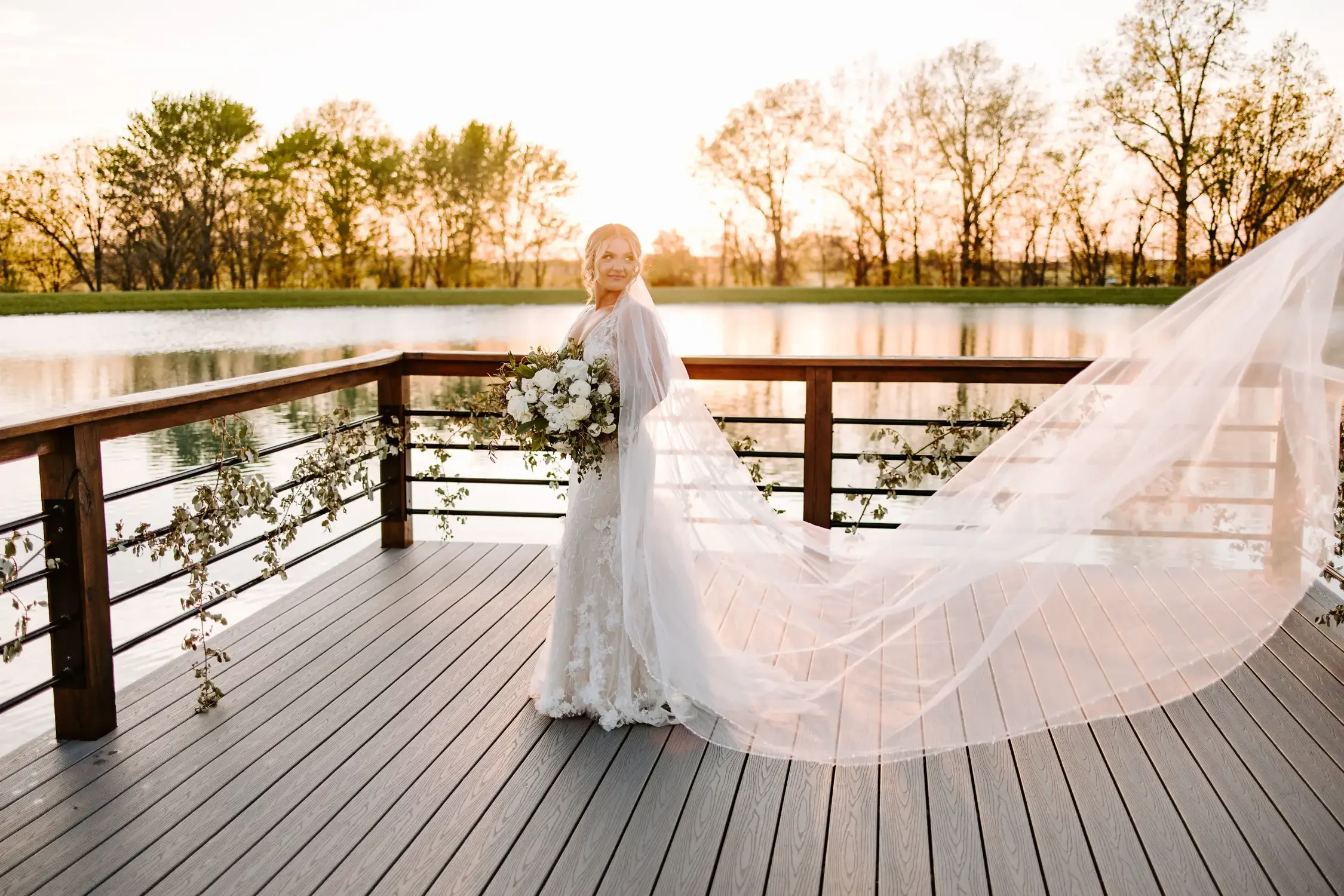 sunset-bridal-portrait-lakeside-deck-emerson-fields-floral-stories.webp