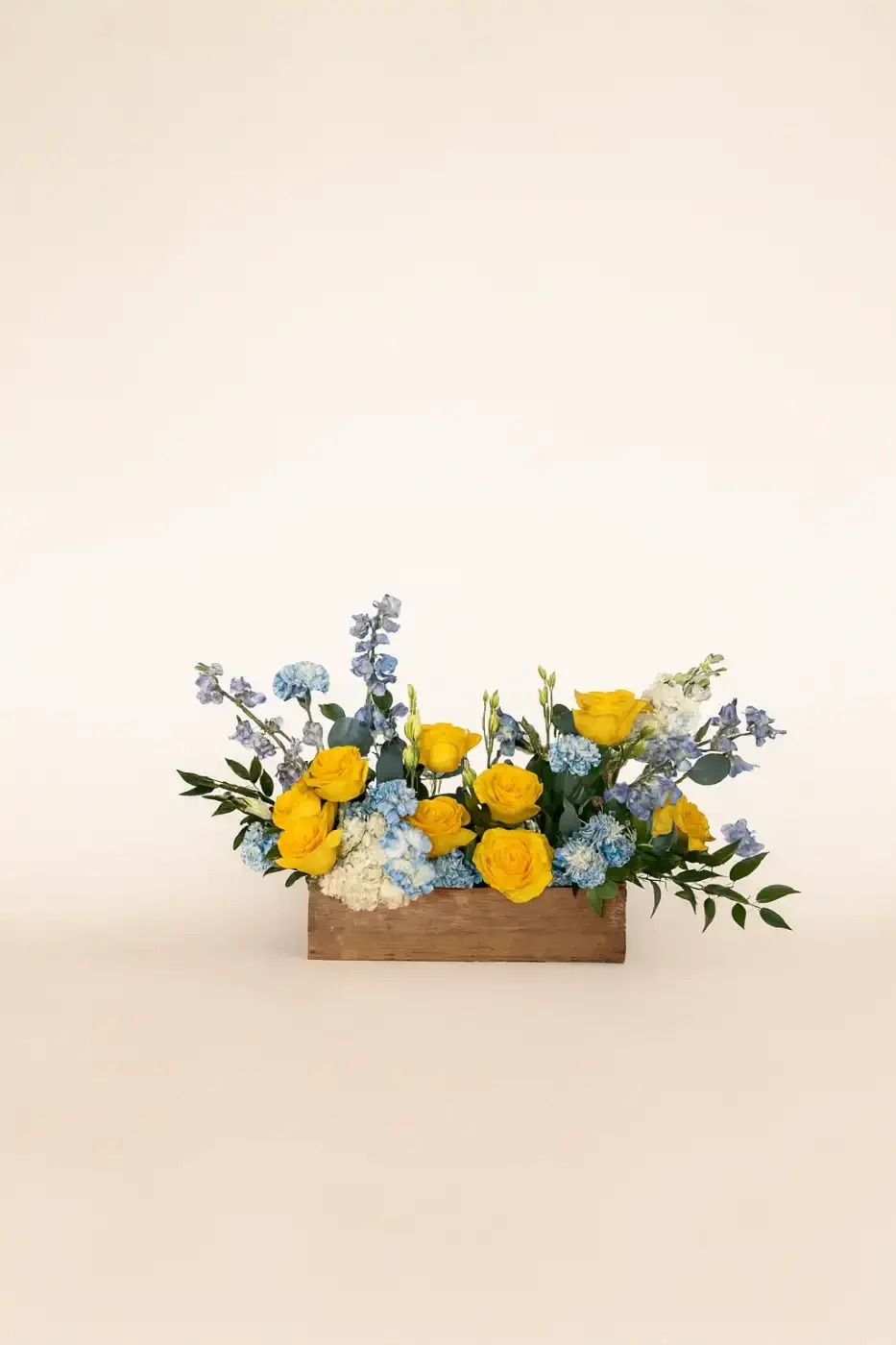 yellow-blue-sympathy-arrangement-floral-stories.webp