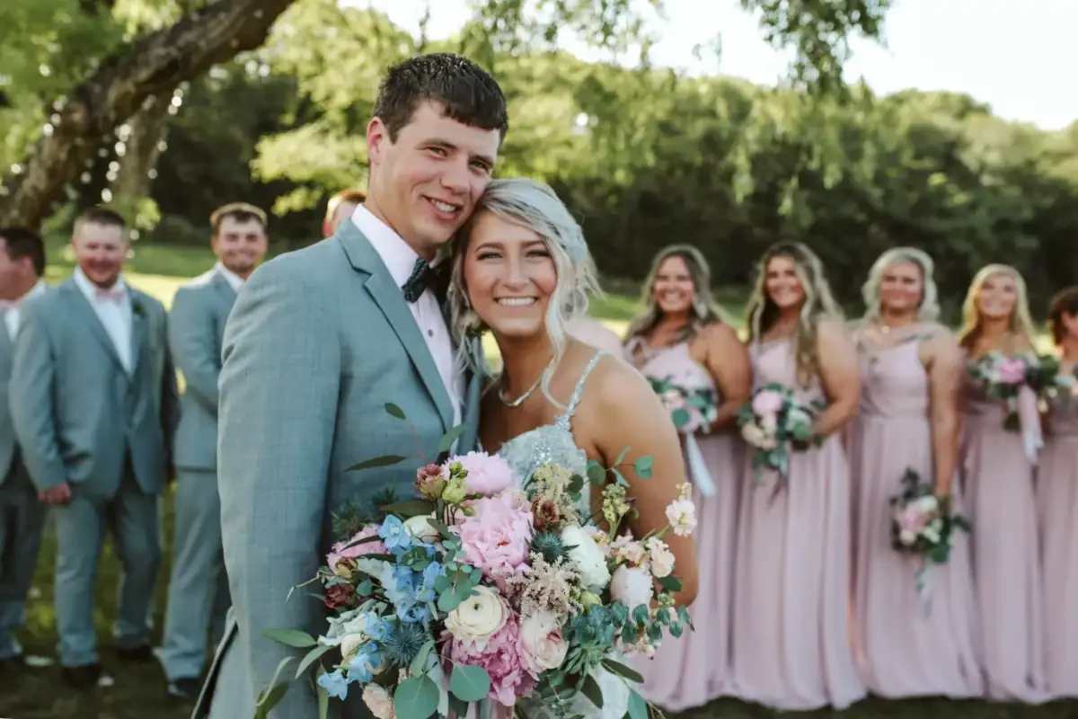 bride-groom-portrait-bridal-party-background-sycamore-tree-savannah-mo.webp