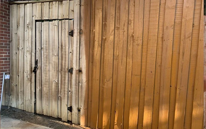 Handyman fixing fence boards Oklahoma City