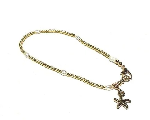 Gold chain bracelet with pearl and starfish charm