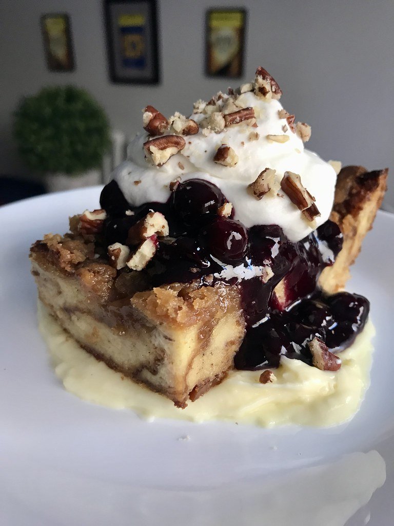 Croissant Bread Pudding (with Pastry Cream, Blueberry Compote, Whipped Cream, and Toasted Pecans). 