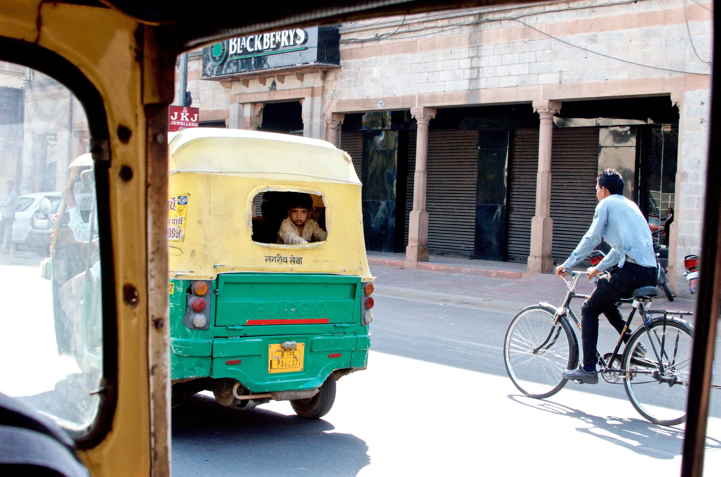 Young boy peeking out of a cab