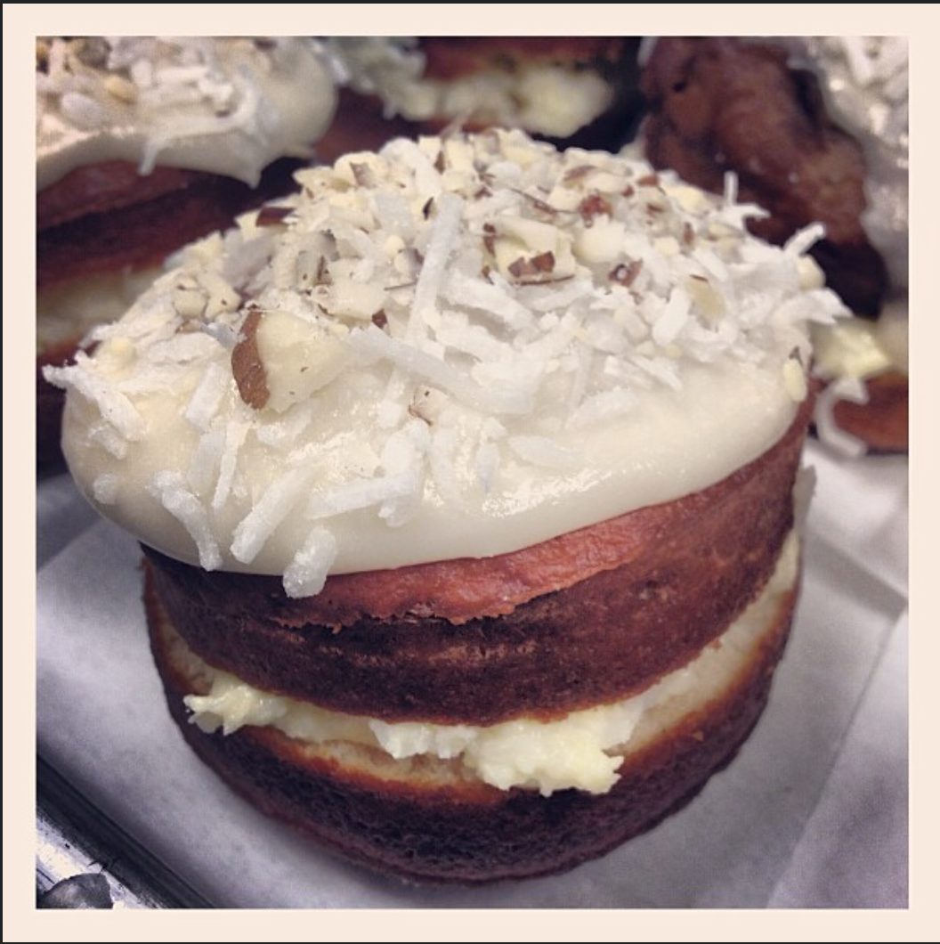 Coconut Cream Donuts with Almond Glaze, Coconut, and Toasted Almonds.