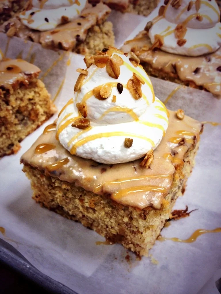 Banana Cake with Maple Glaze, Cinnamon Whipped Cream, Caramel Drizzle, and Granola.