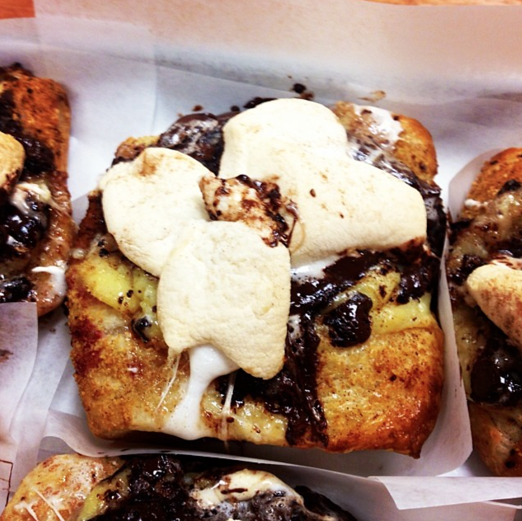 Grown Up Smores Tarts-- Pastry filled with Graham Cracker, topped with Pastry Cream, Callebaut Dark Chocolate, Graham Cracker Crumbs, Marshmallow and Cinnamon.