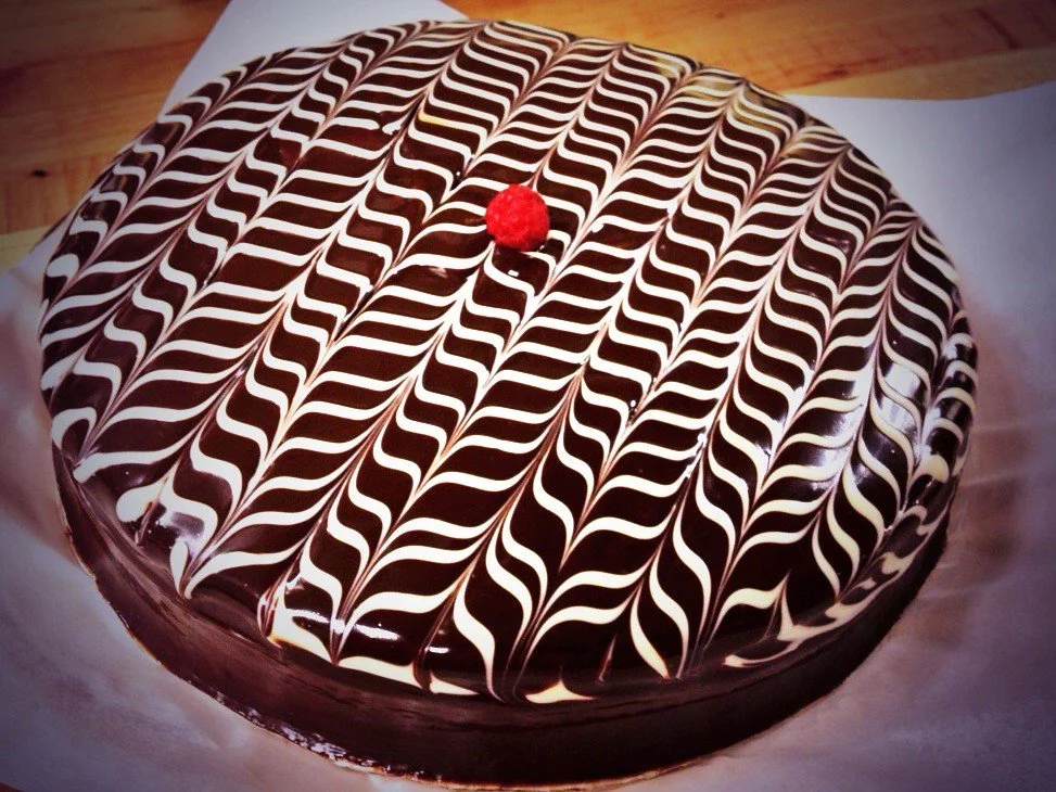 Dark Chocolate Cake with Raspberry Filling and Chocolate Ganache.