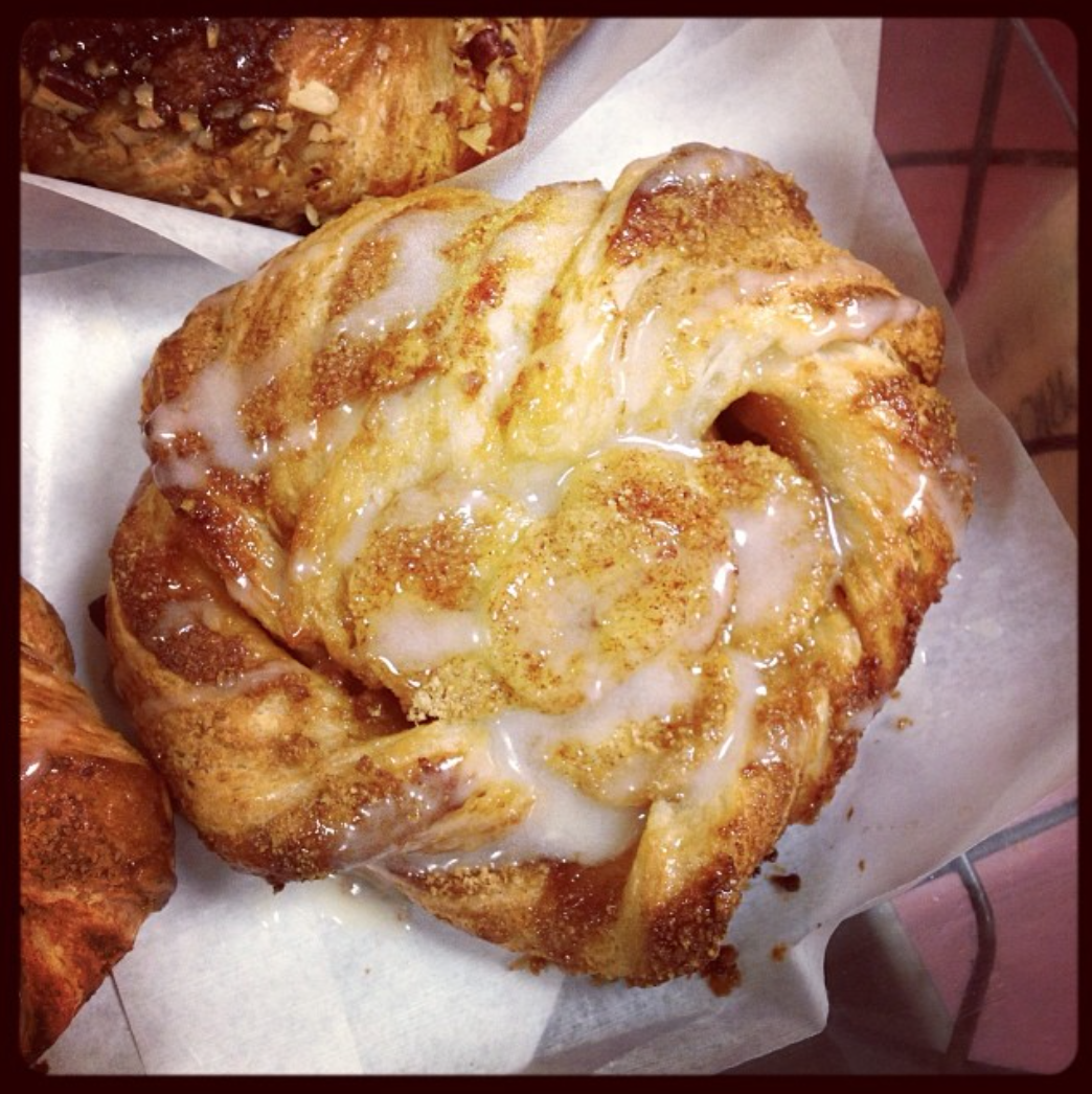 Rum-soaked Banana, Caramel Pastry Cream, Cinnamon, a sprinkling of Graham Cracker Crumbs, and a Rum Cream Cheese Glaze. 