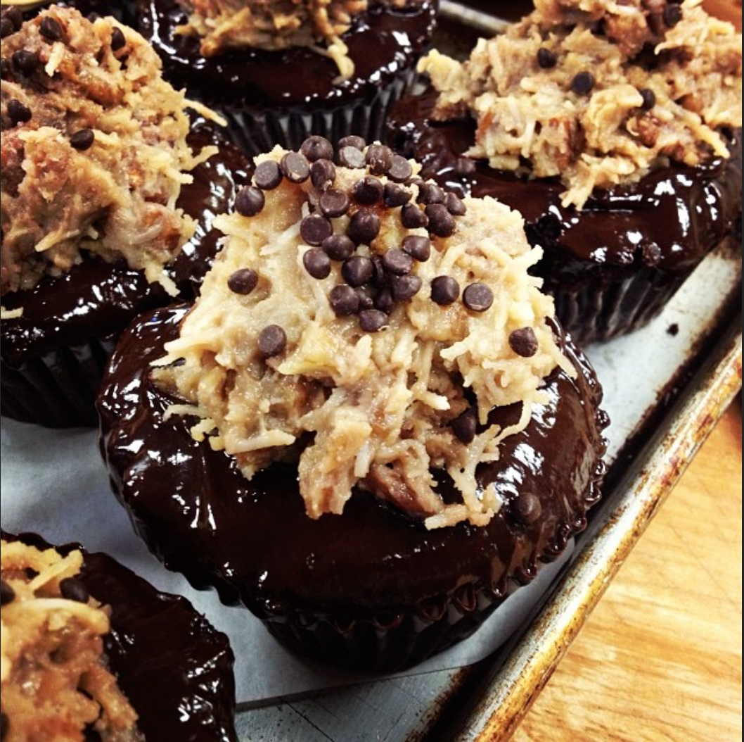 German Chocolate Cupcakes, Dark Chocolate Canache, Coconut Pecan Filling, and Mini Dark Chocolate Chips.