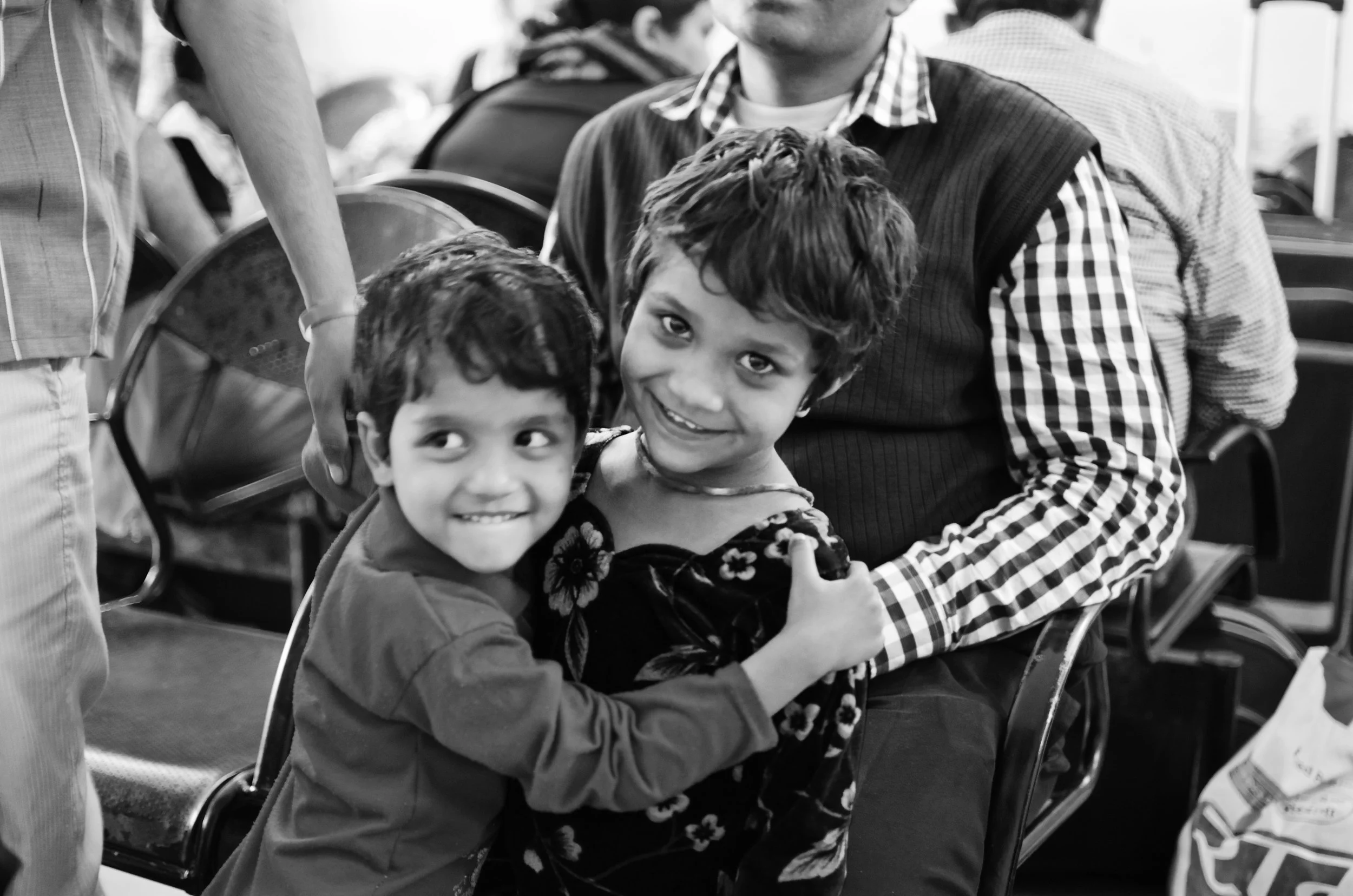 Mischievous siblings at the train statio in Agra
