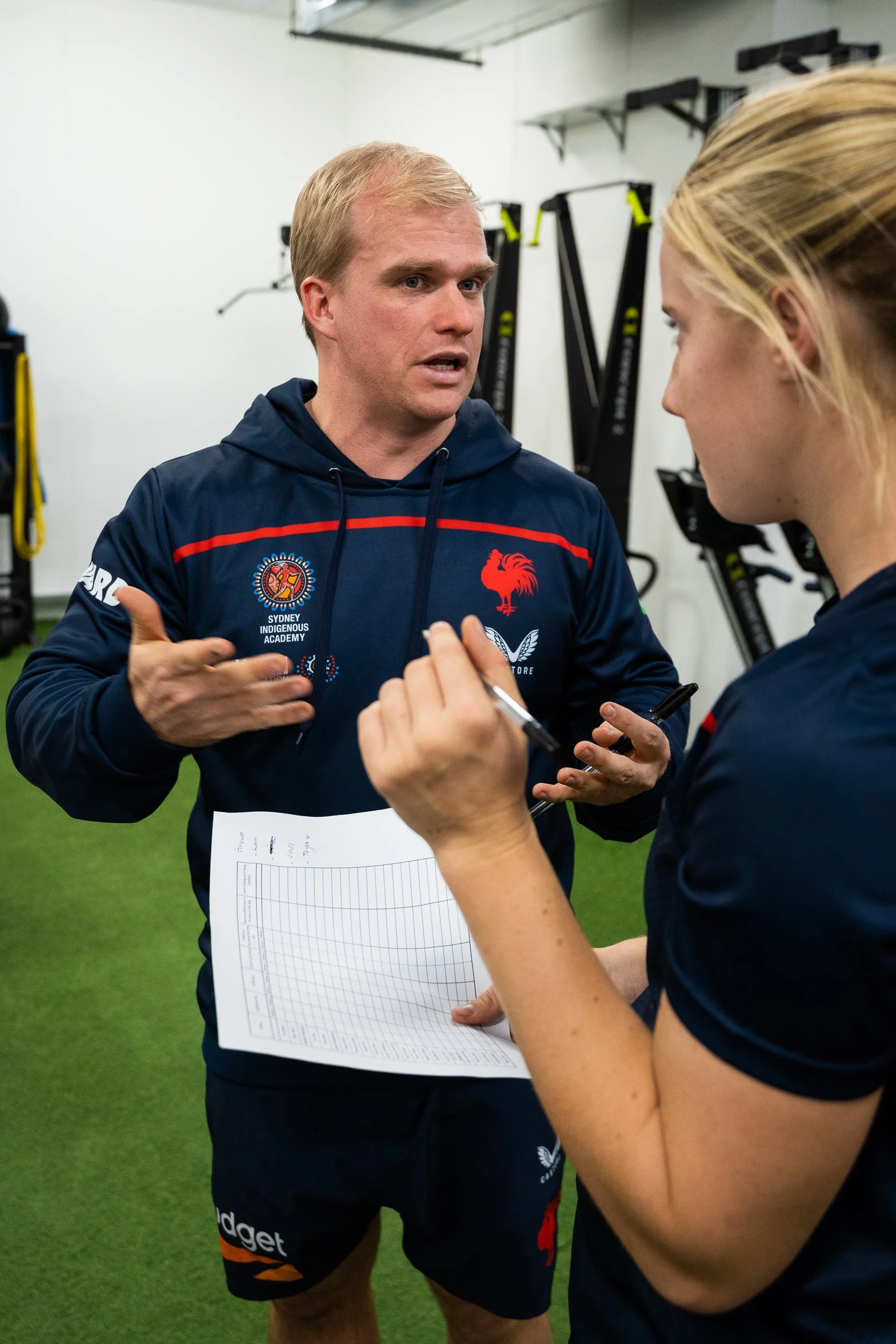 Mitch Vorley coaching a rugby league athlete during a field training session