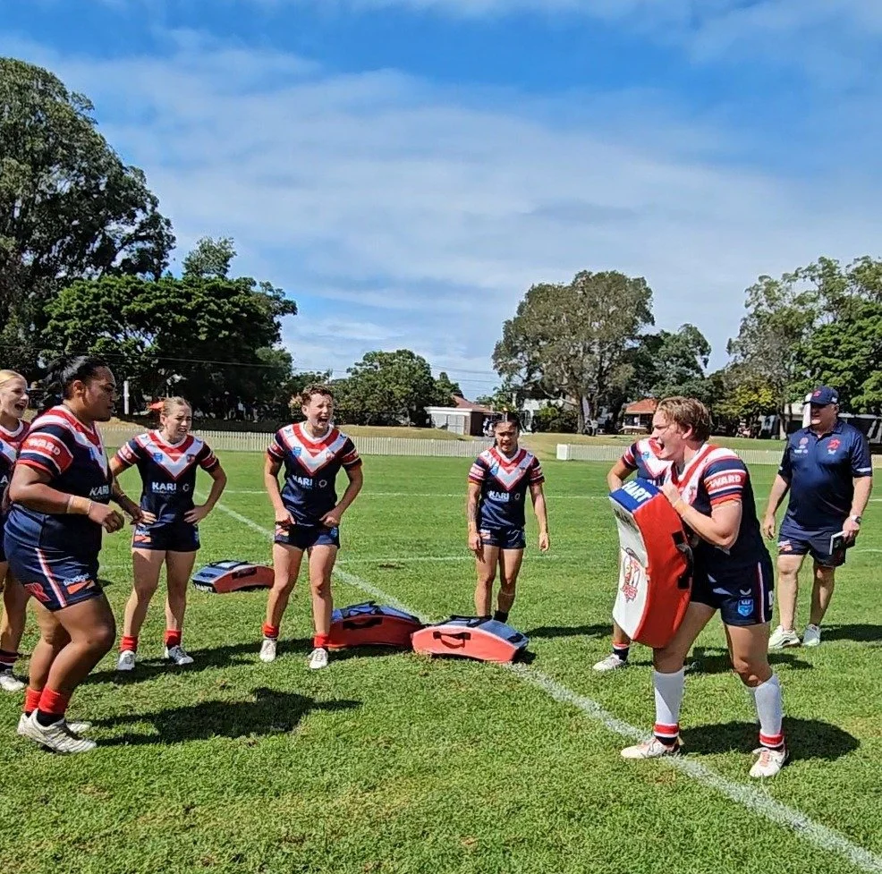 Rugby league athletes completing a field-based training session.