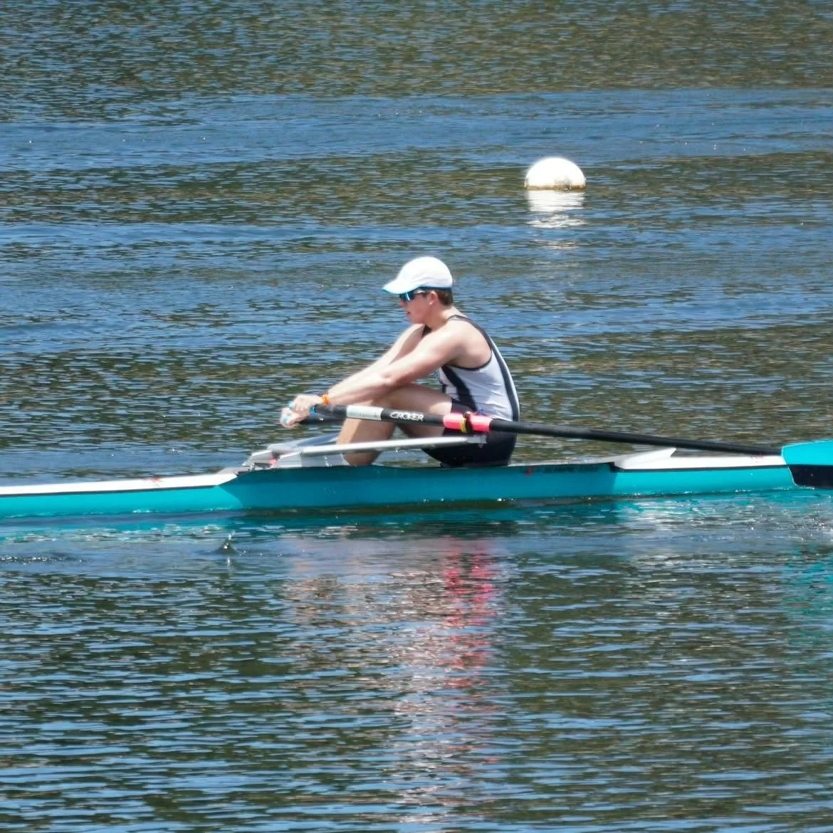 A rowing athlete Mitch coaches in action