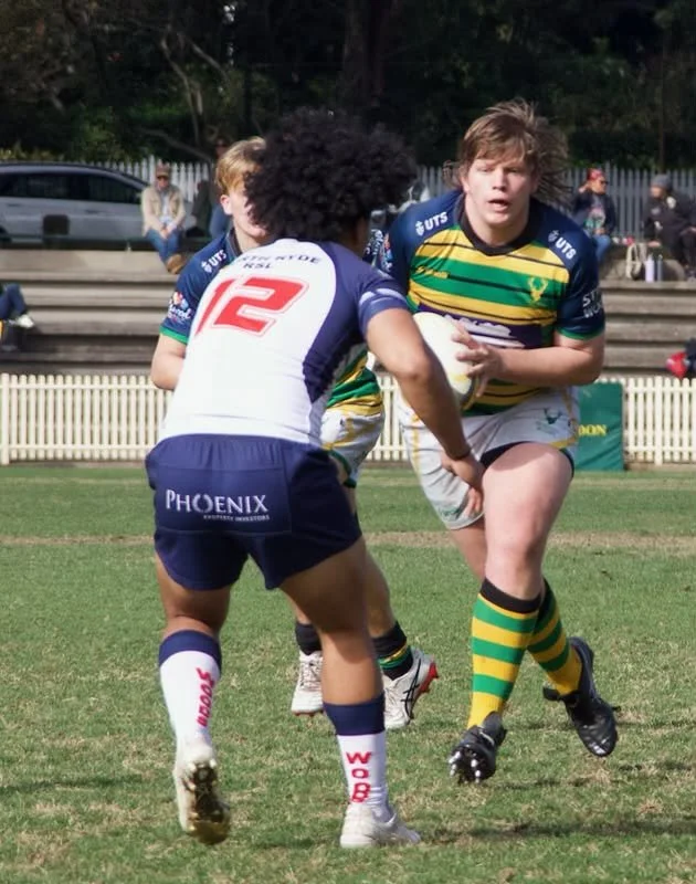 A rugby Athlete Mitch coaches in action