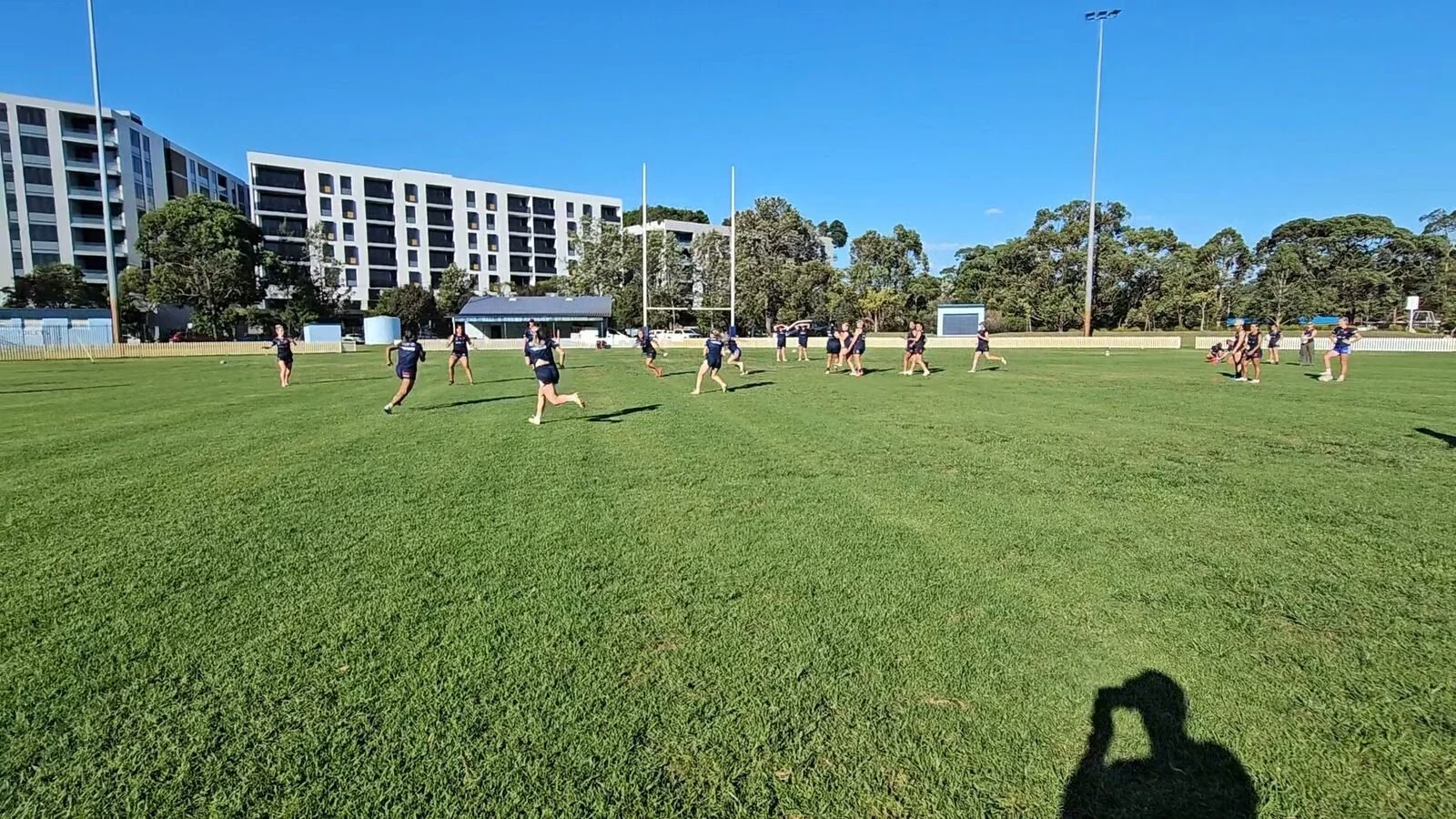 Rugby league athletes completing a field-based training session.