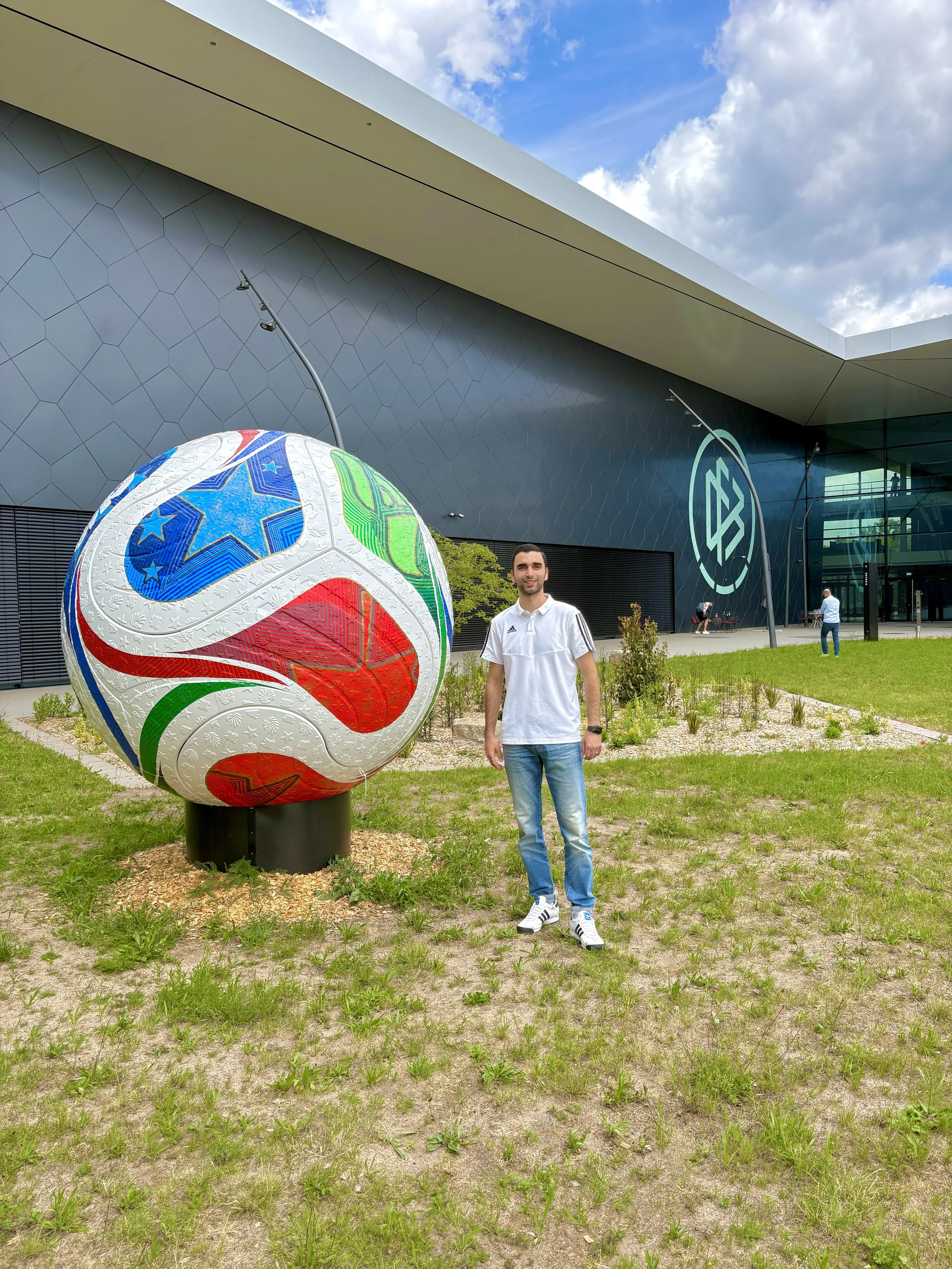 A professional coach from Germany standing in front of DFB Campus in Frankfurt
