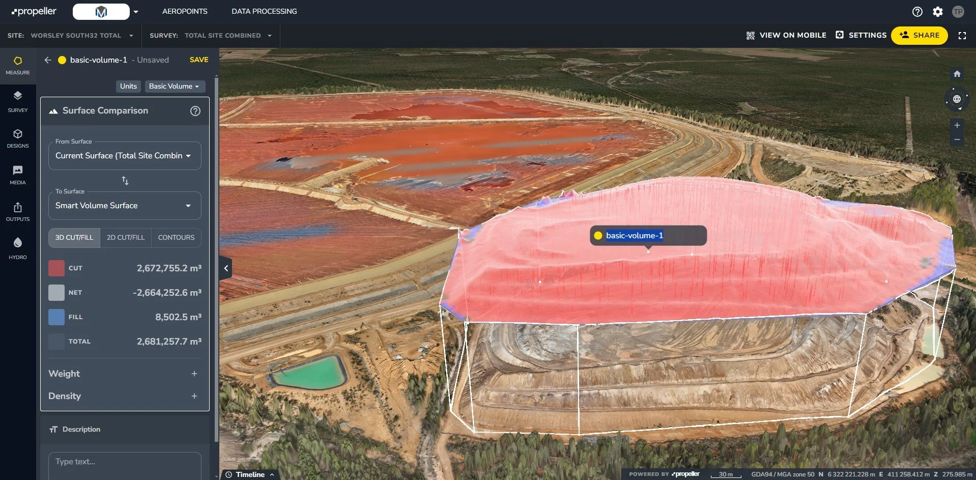 A 3D map view of a quarry with surface volume data overlaid in pink and blue, showing cut and fill volumes in cubic meters.