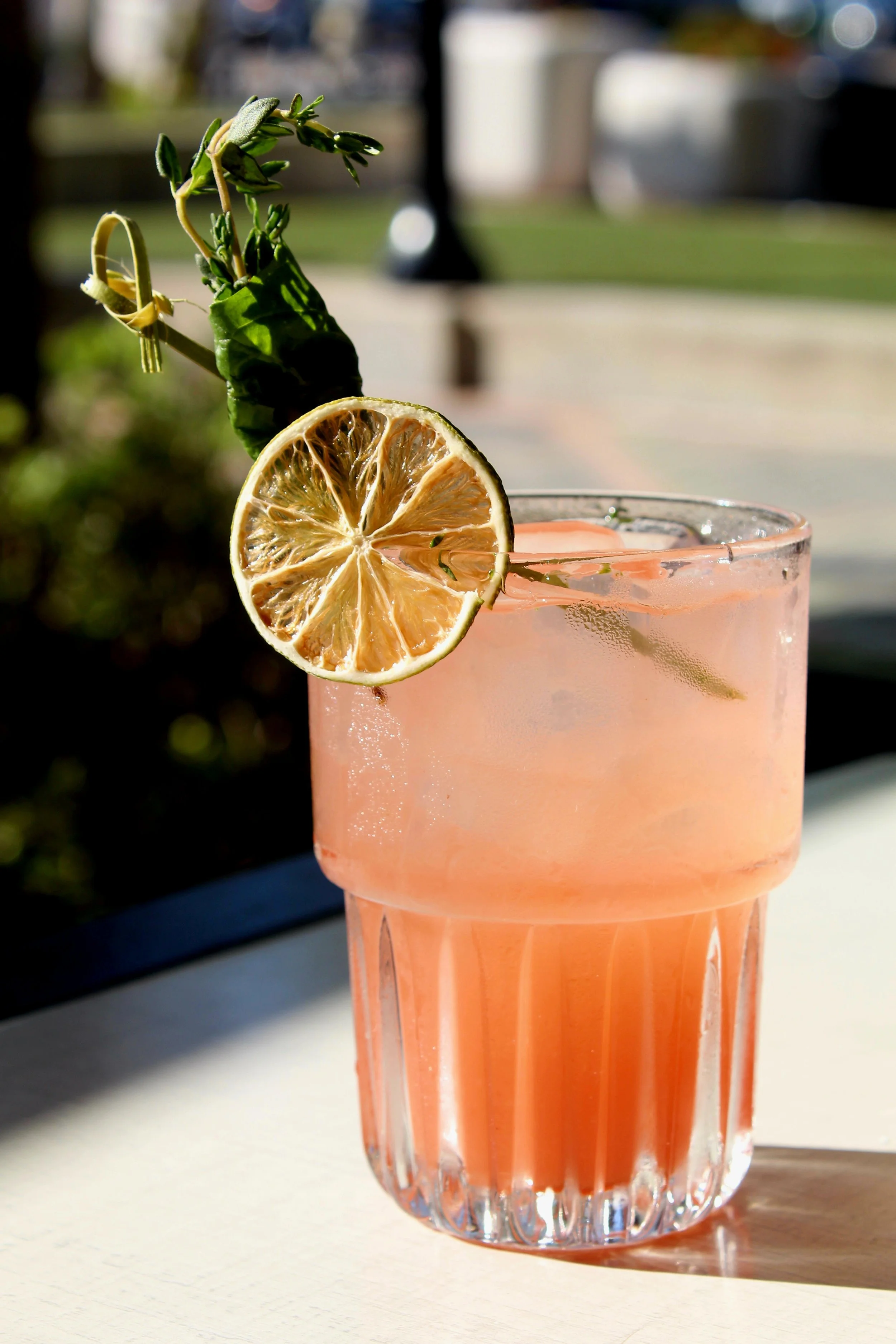 Kiwi Cove: This vibrant creation blends smooth white rum with fresh basil and thyme, layered with juicy strawberry, tangy kiwi, and brightened with lime juice.