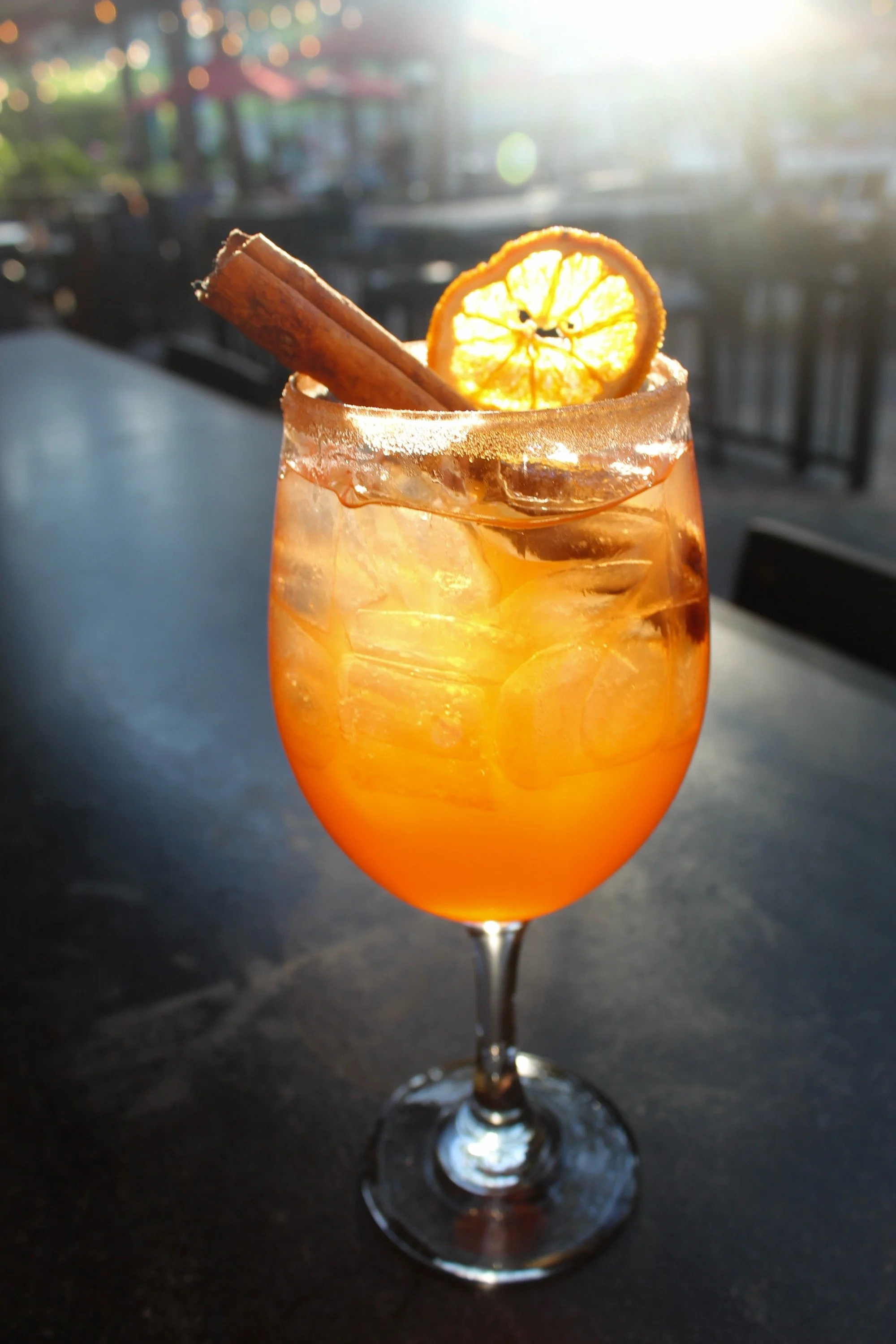 Harvest Spritz: This festive spritz blends bright Aperol with spiced cinnamon apple cider, and topped with champagne and a splash of club soda, and a cinnamon sugar rim for a warm seasonal touch
