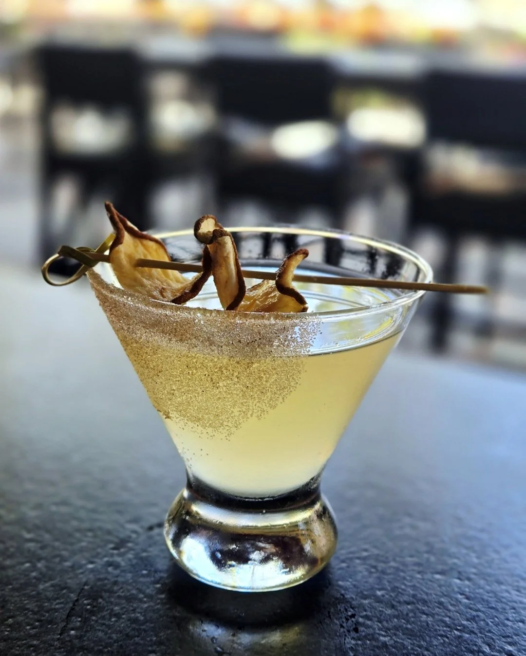The Spiced Pear: This martini pairs crisp aromatic gin with the warmth of spiced pear and a bright touch of lemon, elegantly finished with a cinnamon-sugar rim and spiced pear crisps.