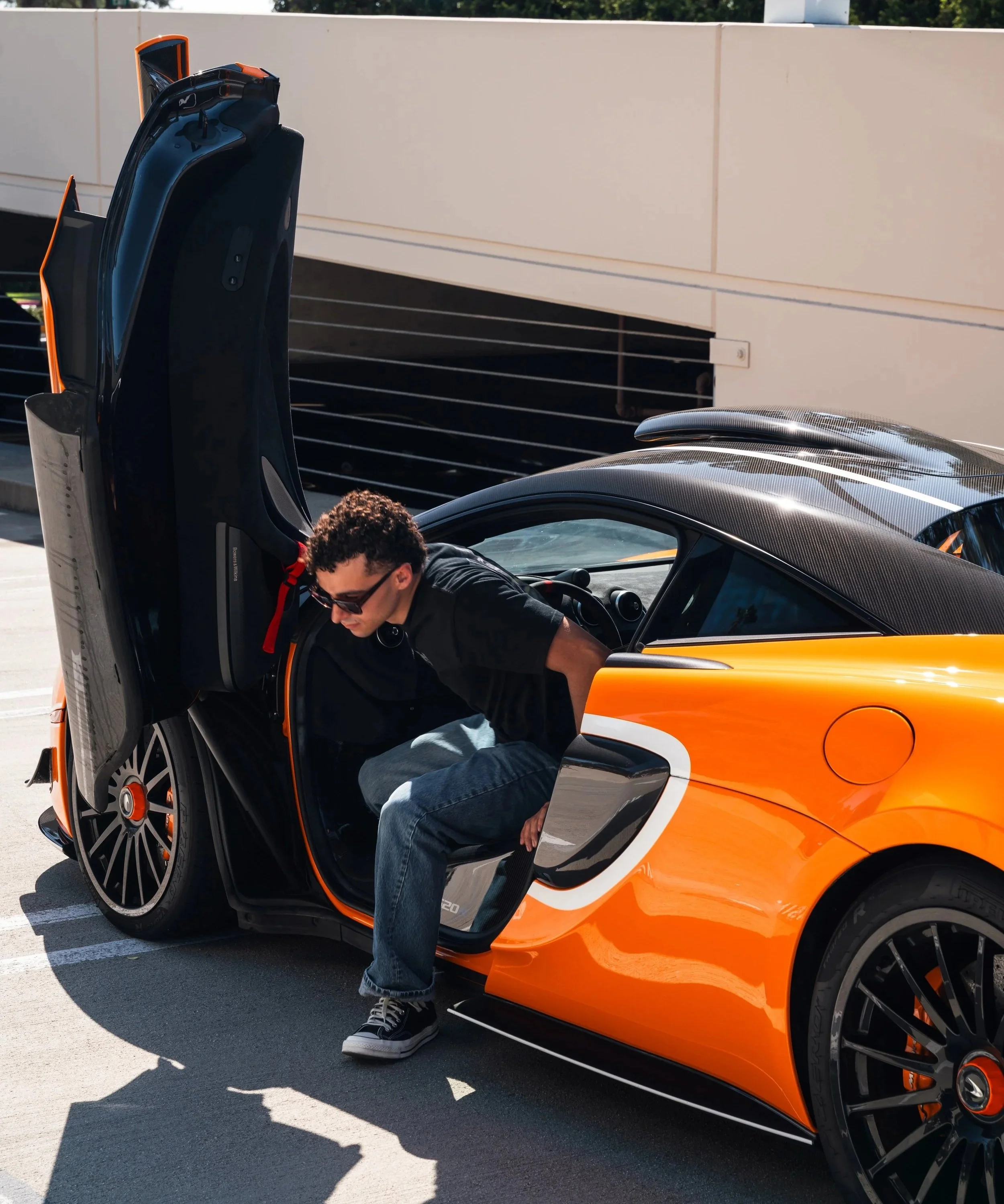 Enzo stepping out of his car