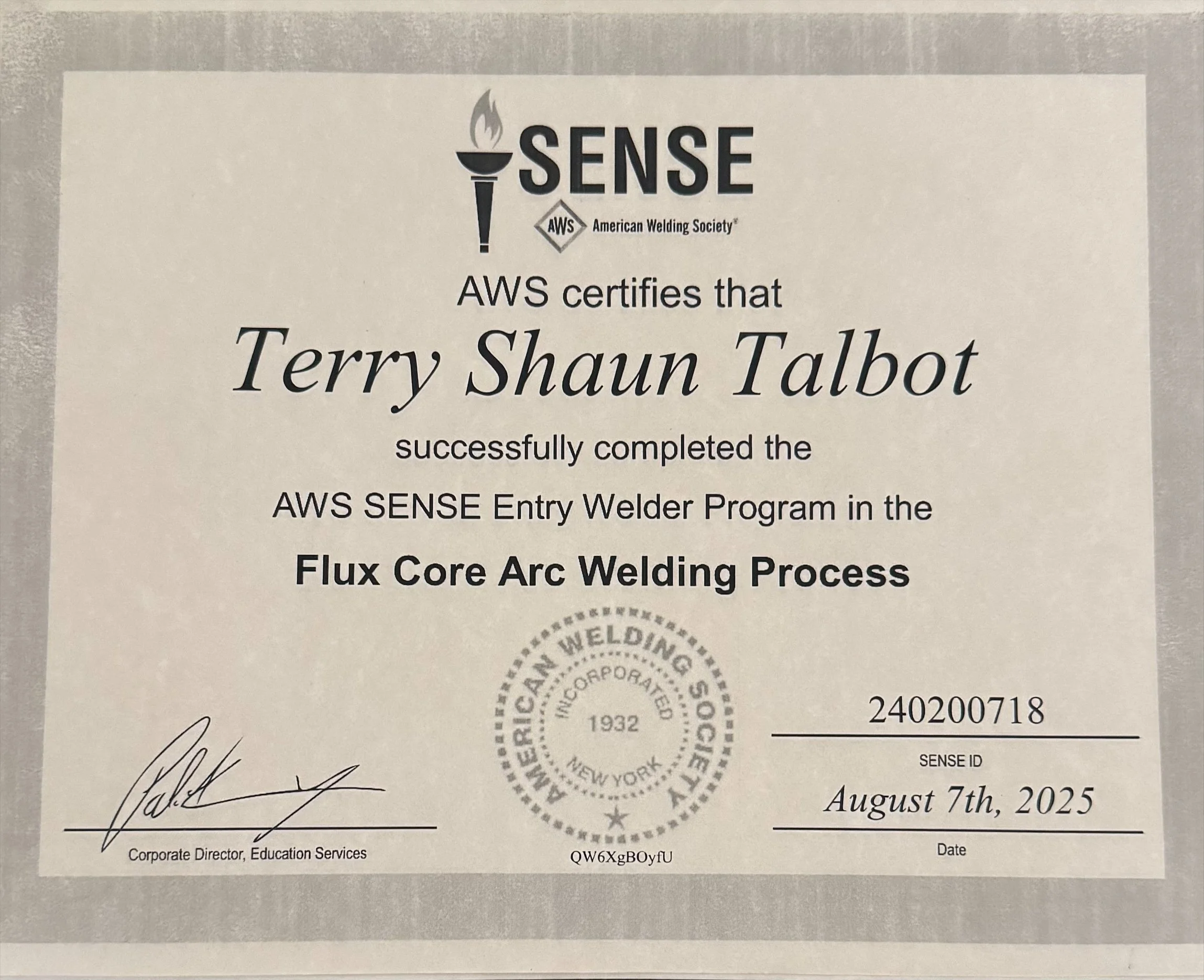 Certificate awarded to Terry Shaun Talbot for completing the AWS SENSE Entry Welder Program in the Flux Core Arc Welding Process, signed by the Corporate Director of Education Services, dated August 7, 2025.