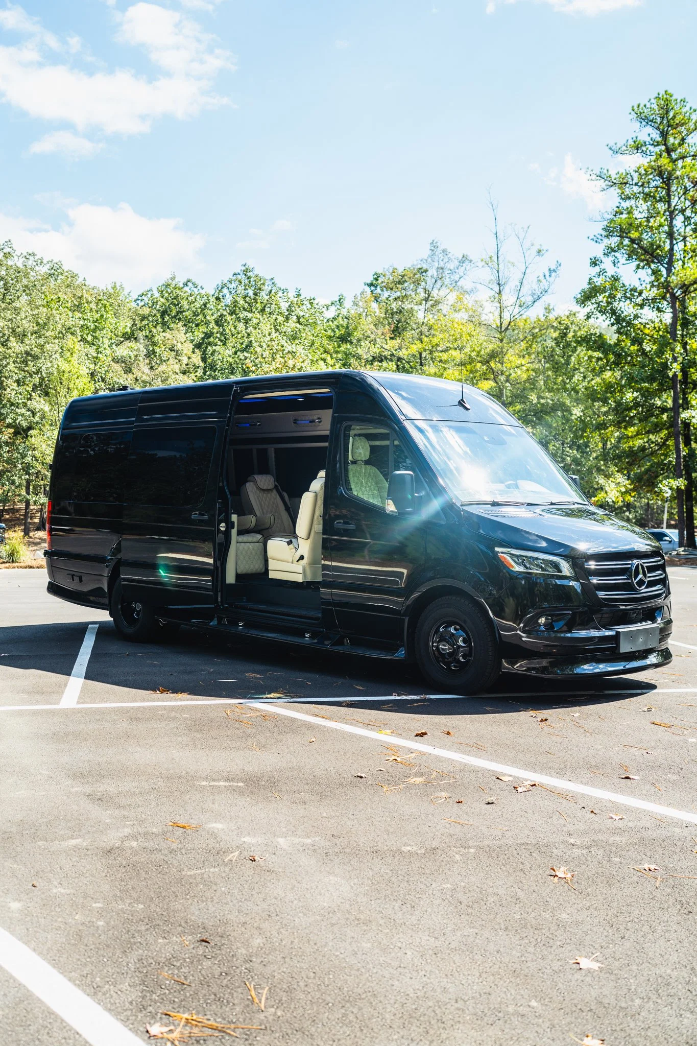 Black Mercedes Sprinter van with open door showing luxury interior seating in Birmingham AL