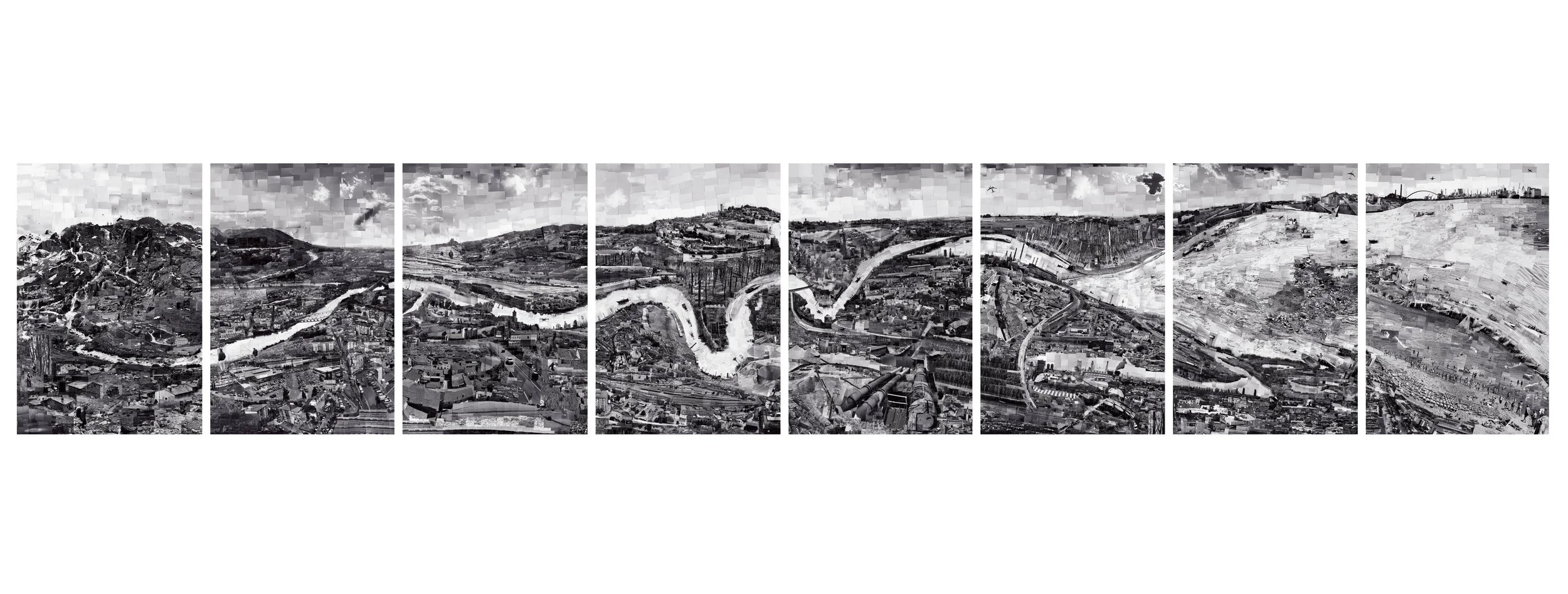 山と川が見える街の航空写真で、都市の工場や建物も映っている。