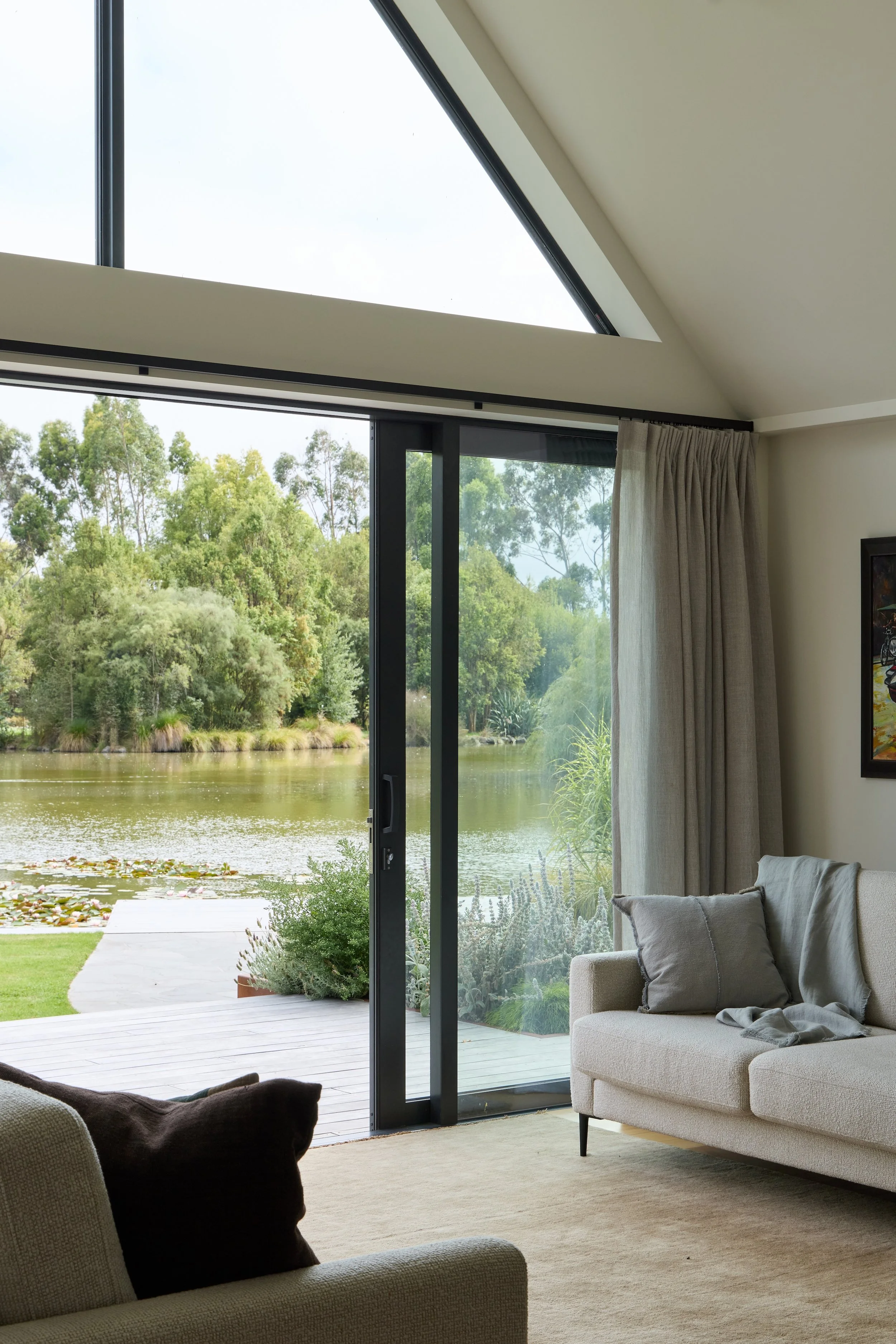 Greenslade Residence Tai Tapu – lakeside home alteration with oak, cedar and clay plaster interiors by AW Architects (2026)