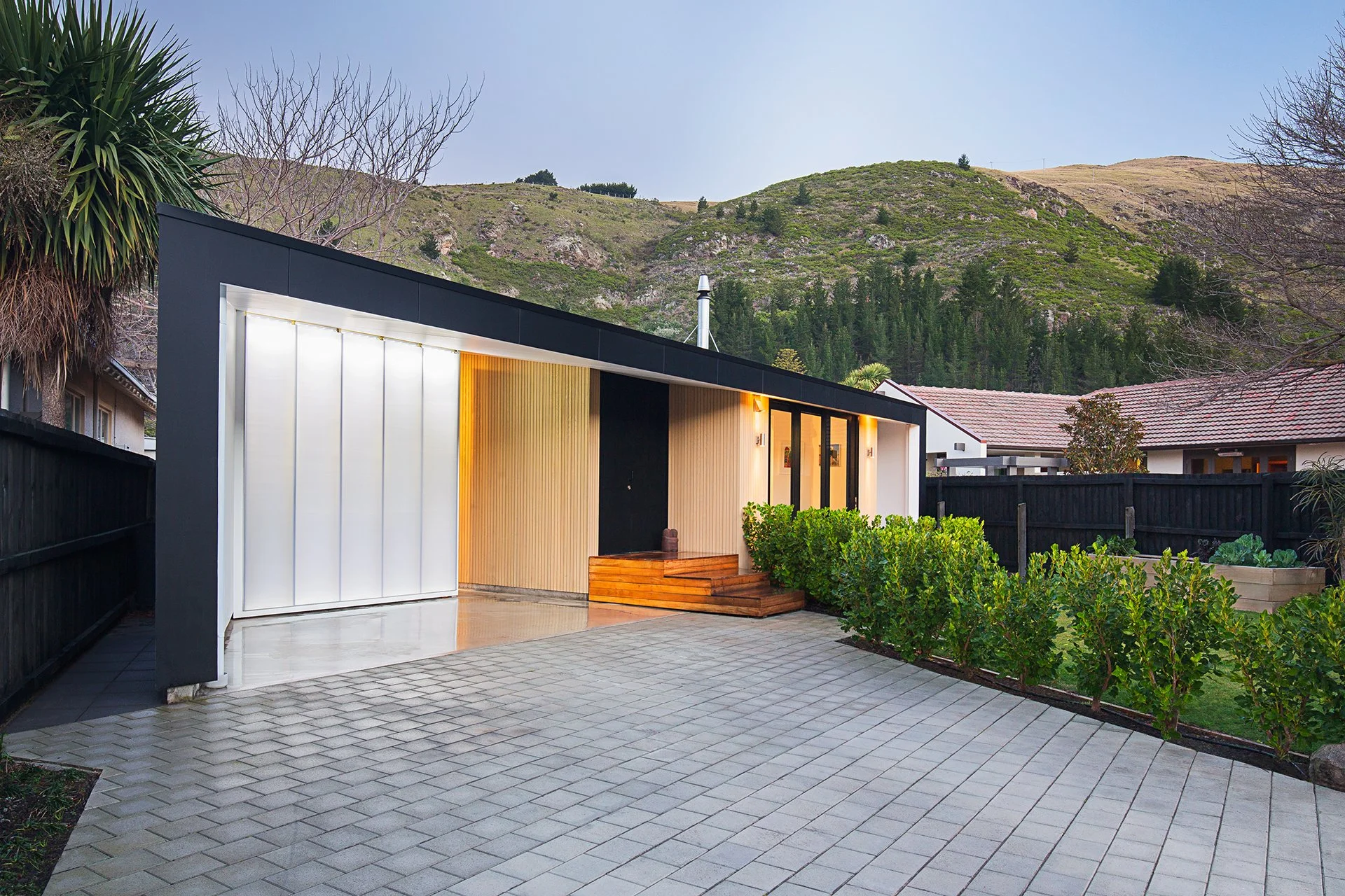 Sumner House – Christchurch rebuild home with maple courtyard and recycled materials by AW Architects (2016)