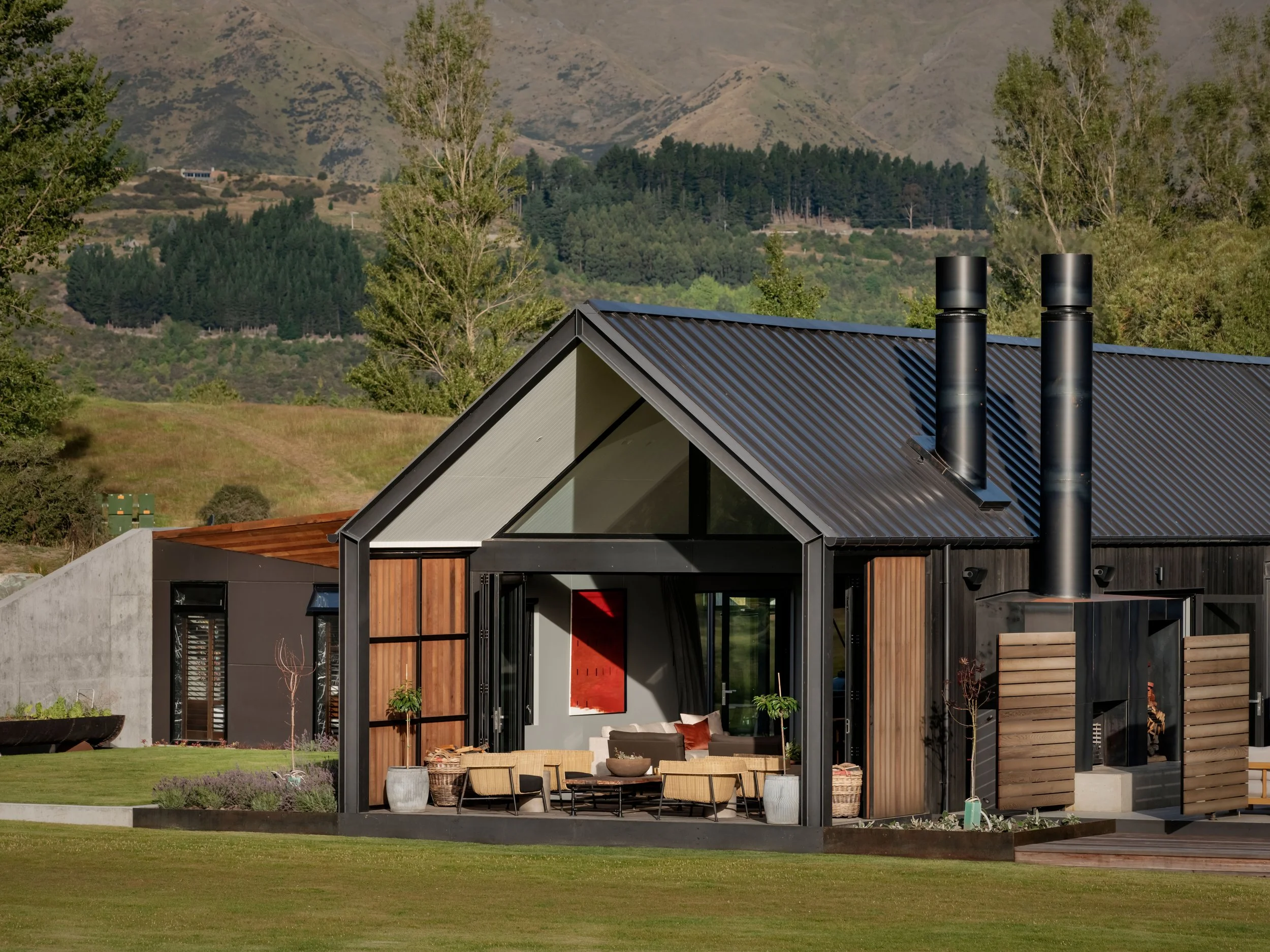 Arrowtown Queenstown house with three pods around courtyards – AW Architects NZIA 2021