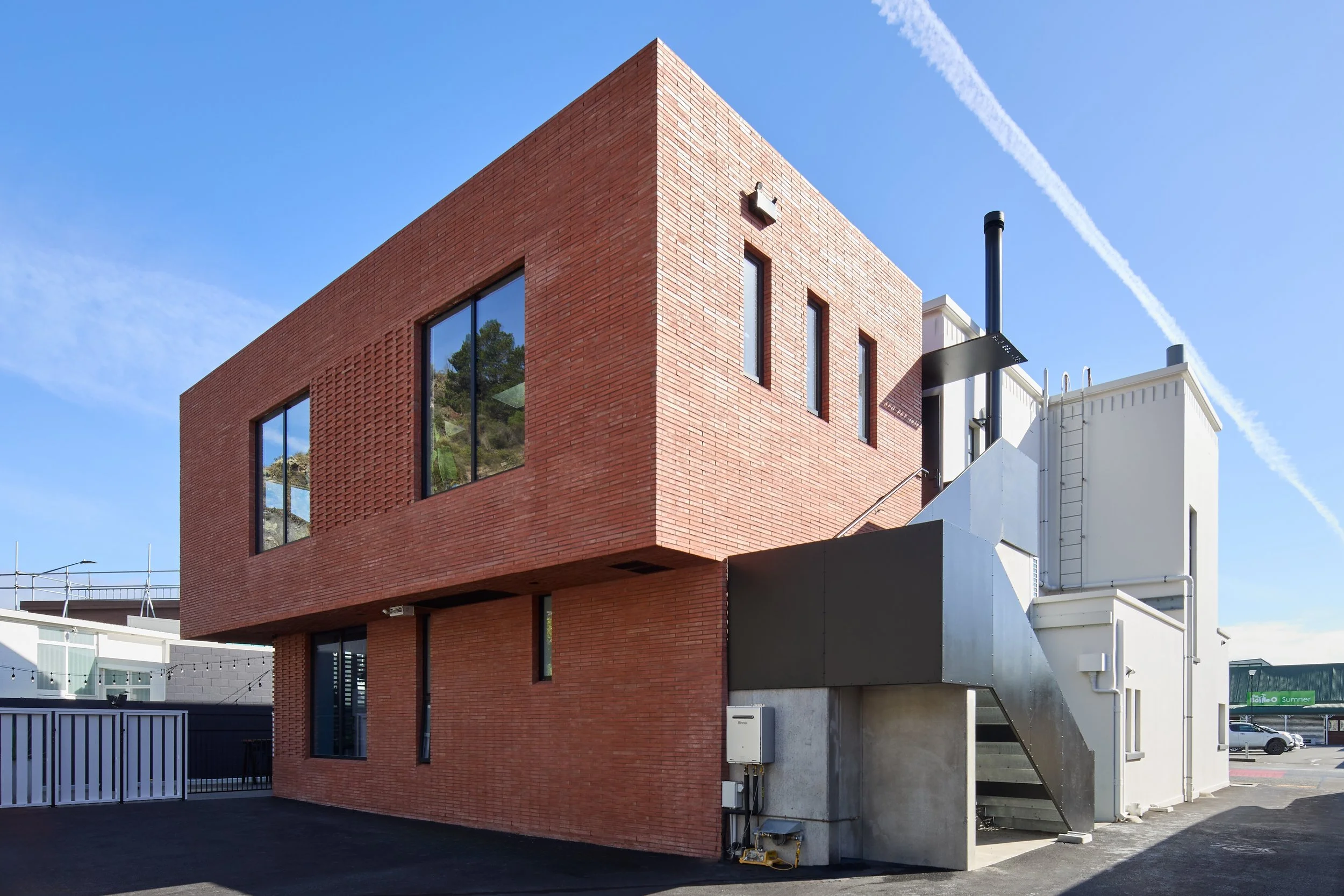 Sumner Post Office heritage building with red brick extension – AW Architects NZIA 2025