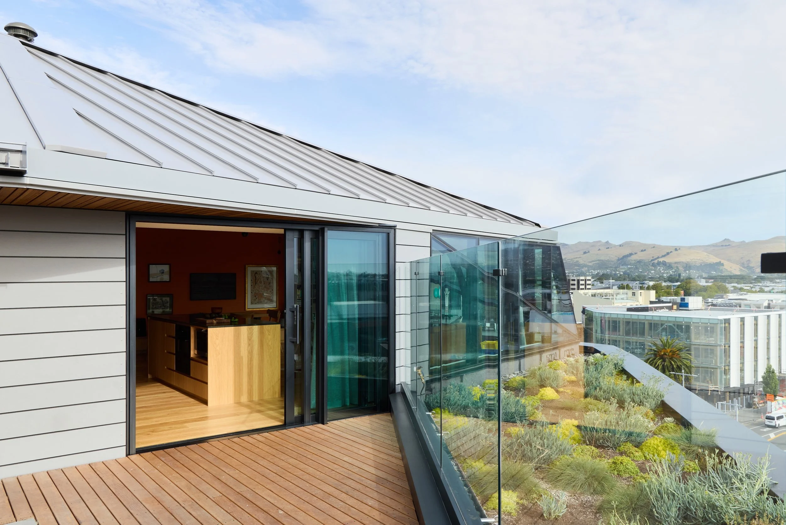 City Residence Ōtautahi Christchurch – Level 6 city apartment with folding roof and Port Hills views by AW Architects (2026)