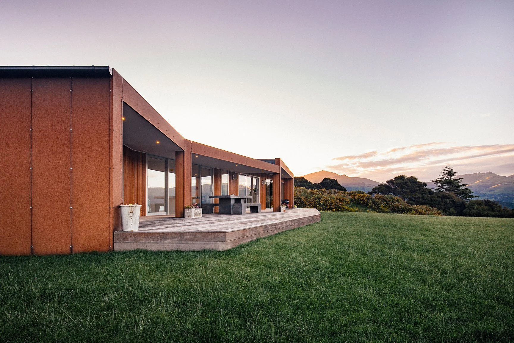 Akaroa Volcanic Ridge House – angular cedar and corten home overlooking Banks Peninsula by AW Architects (2014)