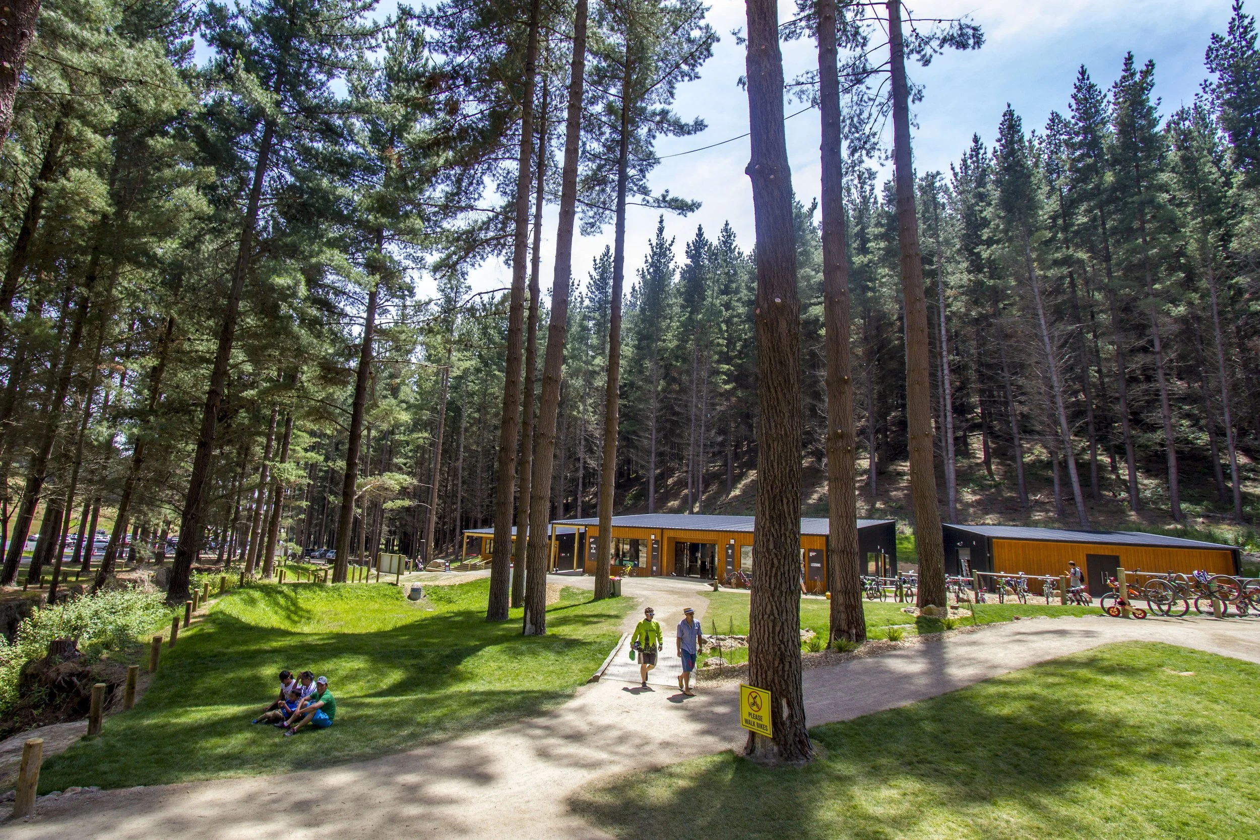 Christchurch Adventure Park – black-clad recreational hub in forest with folded-roof café by AW Architects (2017).
