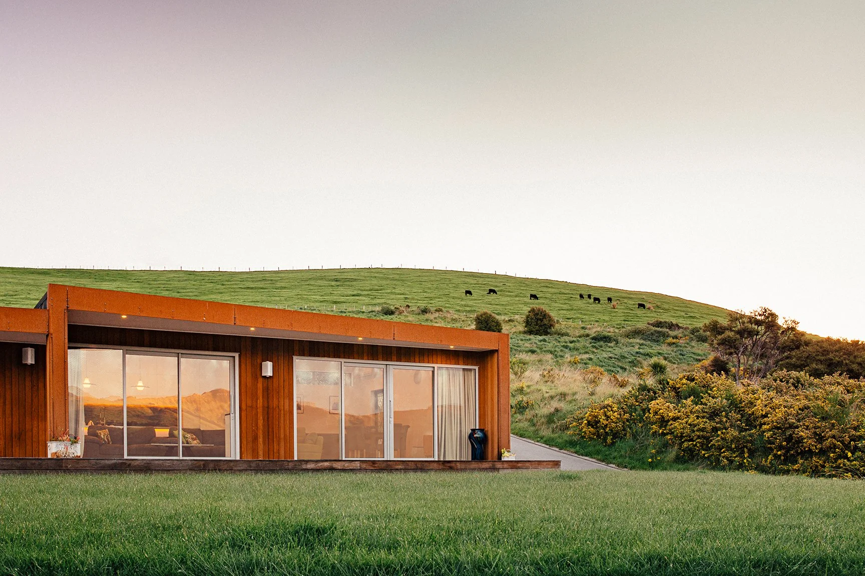 Akaroa Volcanic Ridge House – angular cedar and corten home overlooking Banks Peninsula by AW Architects (2014)