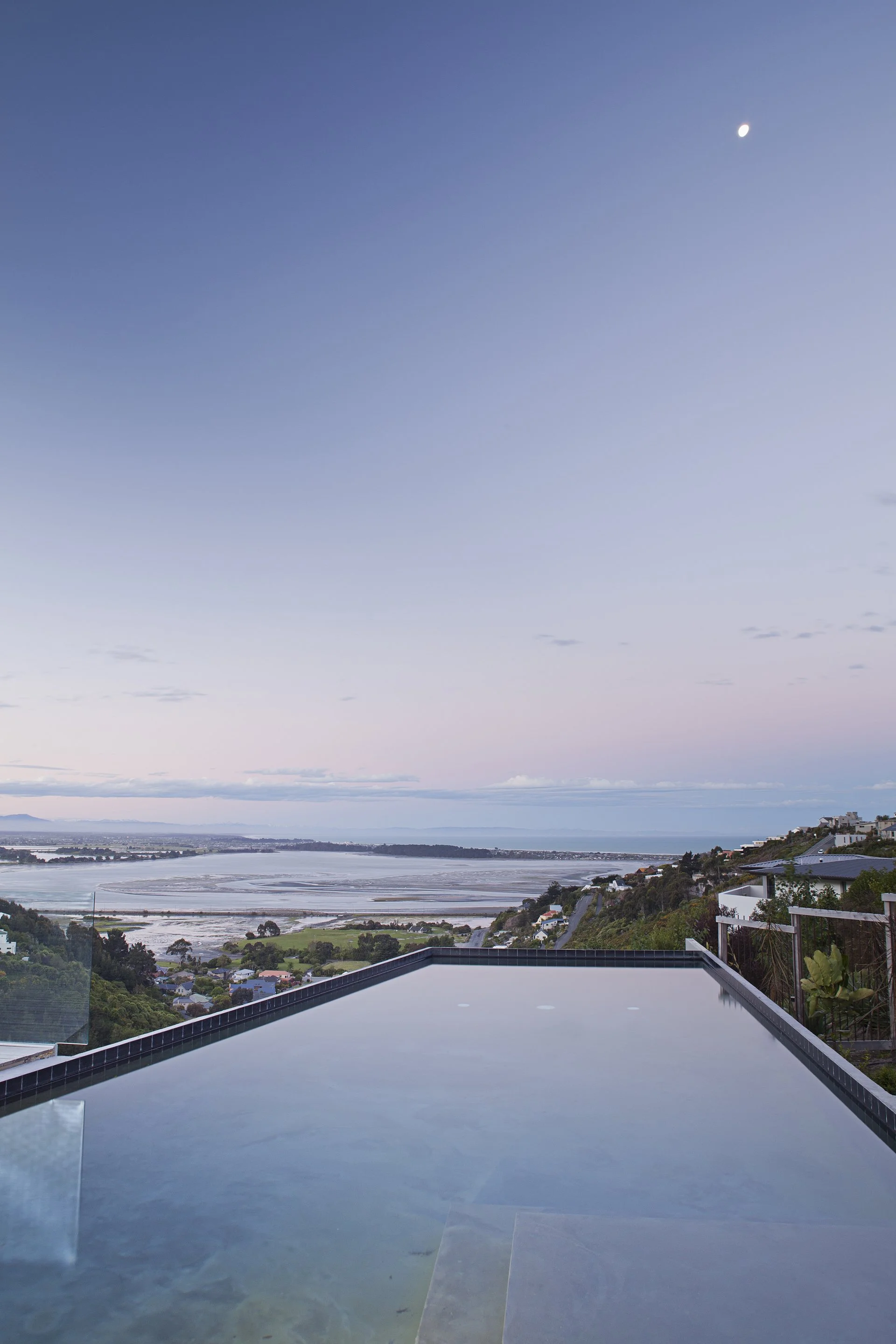 Redcliffs Cor-Ten House – Christchurch coastal home in weathered steel with expansive glazing by AW Architects (2012).