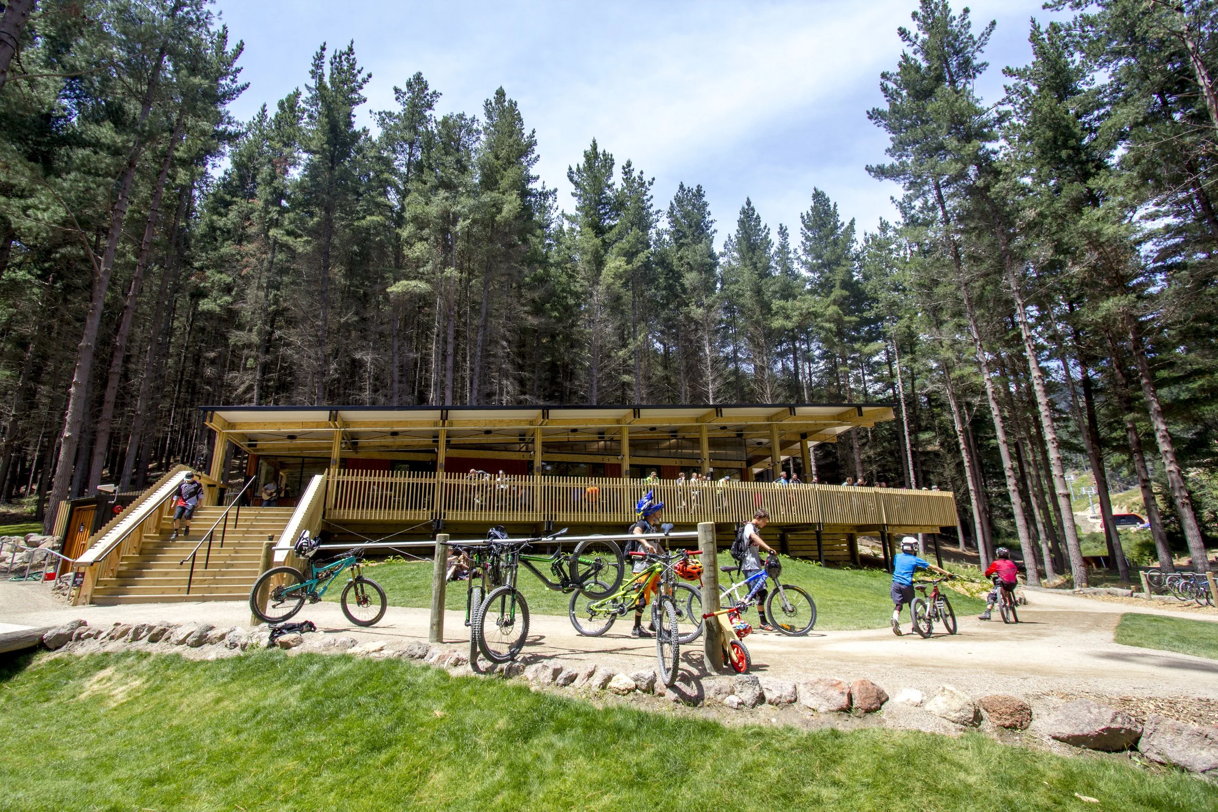 Christchurch Adventure Park – black-clad recreational hub in forest with folded-roof café by AW Architects (2017).