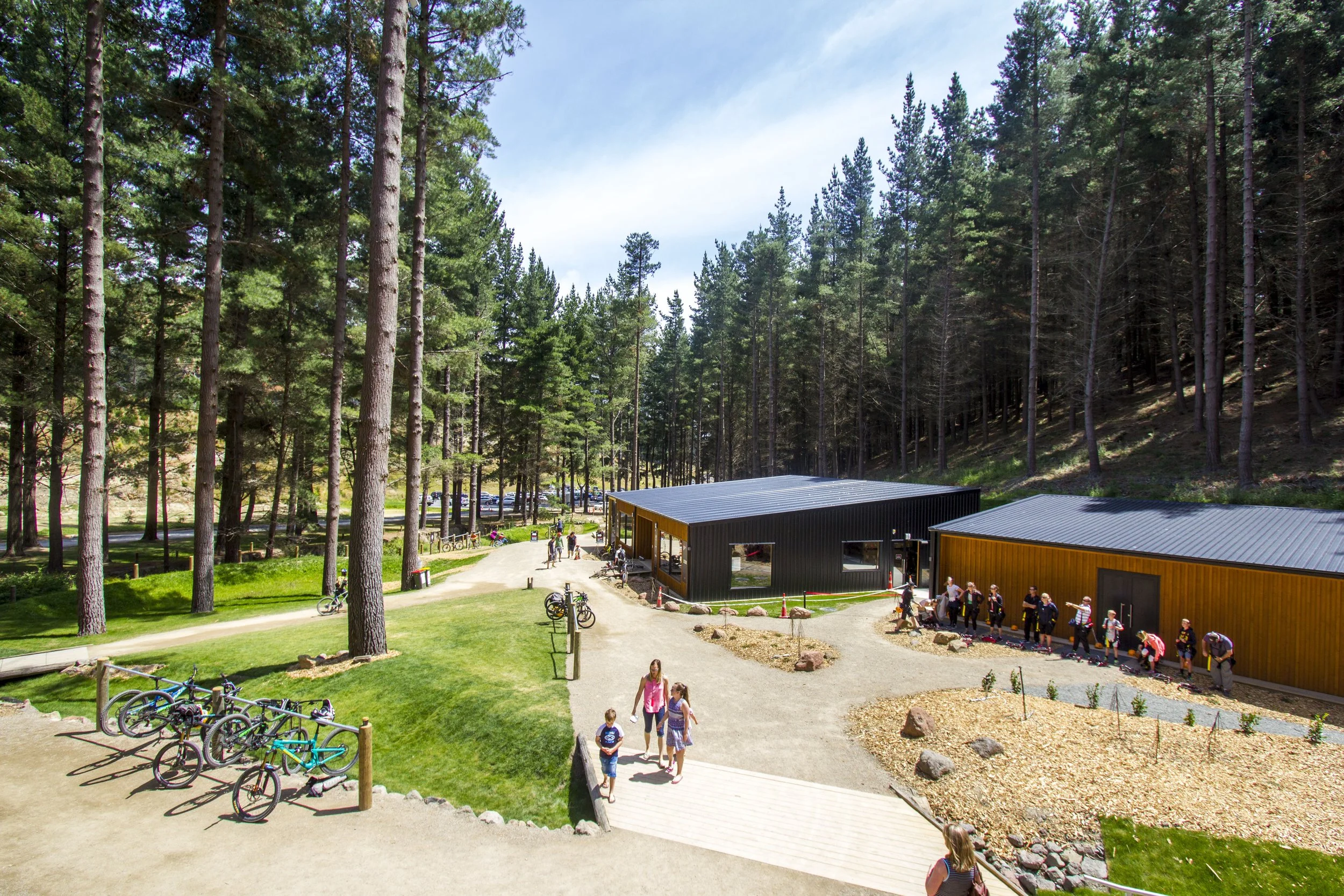 Christchurch Adventure Park – black-clad recreational hub in forest with folded-roof café by AW Architects (2017).