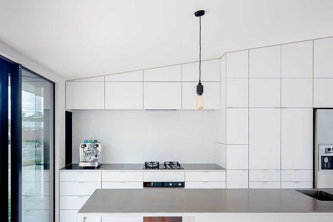 Sumner House – Christchurch rebuild home with maple courtyard and recycled materials by AW Architects (2016)