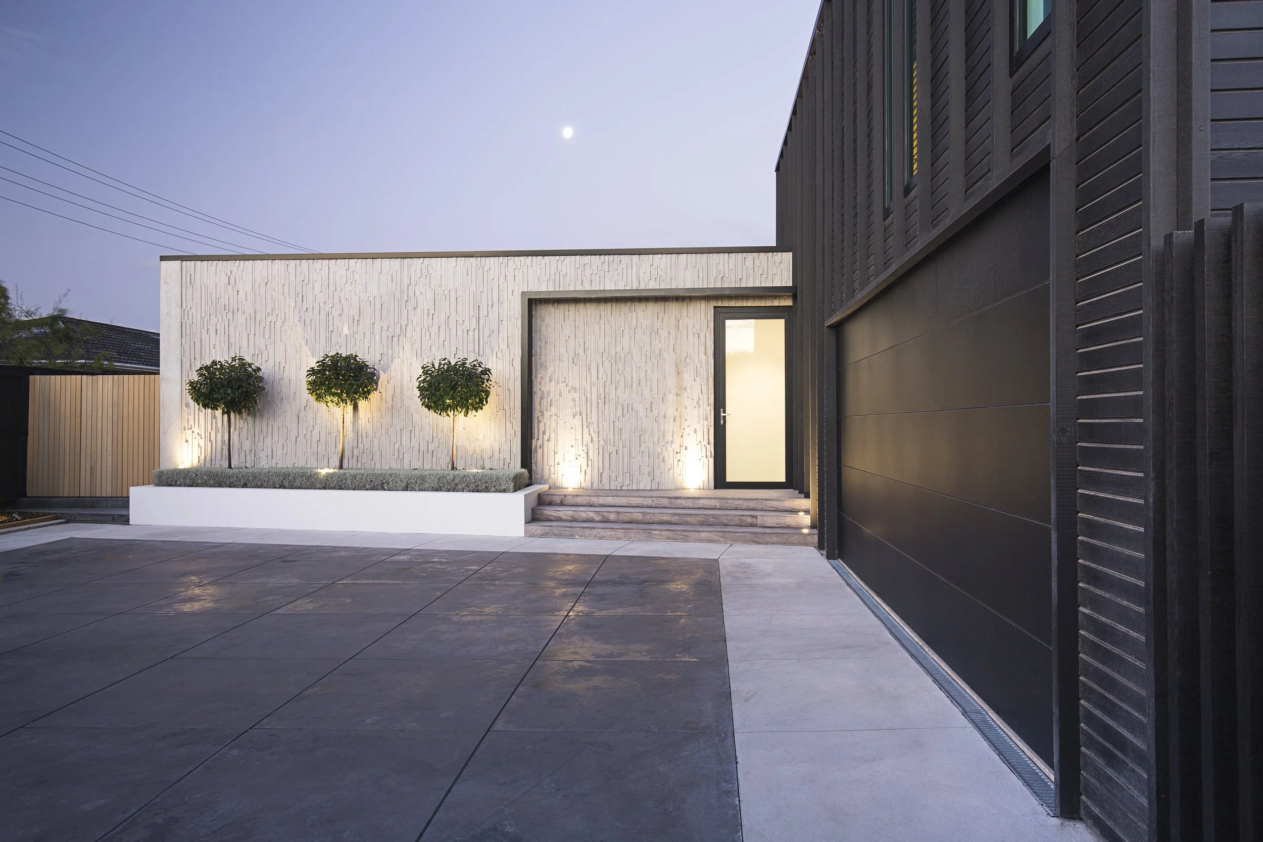 Barrington St House – timber-clad Christchurch residence with dramatic street frontage by AW Architects (2016)