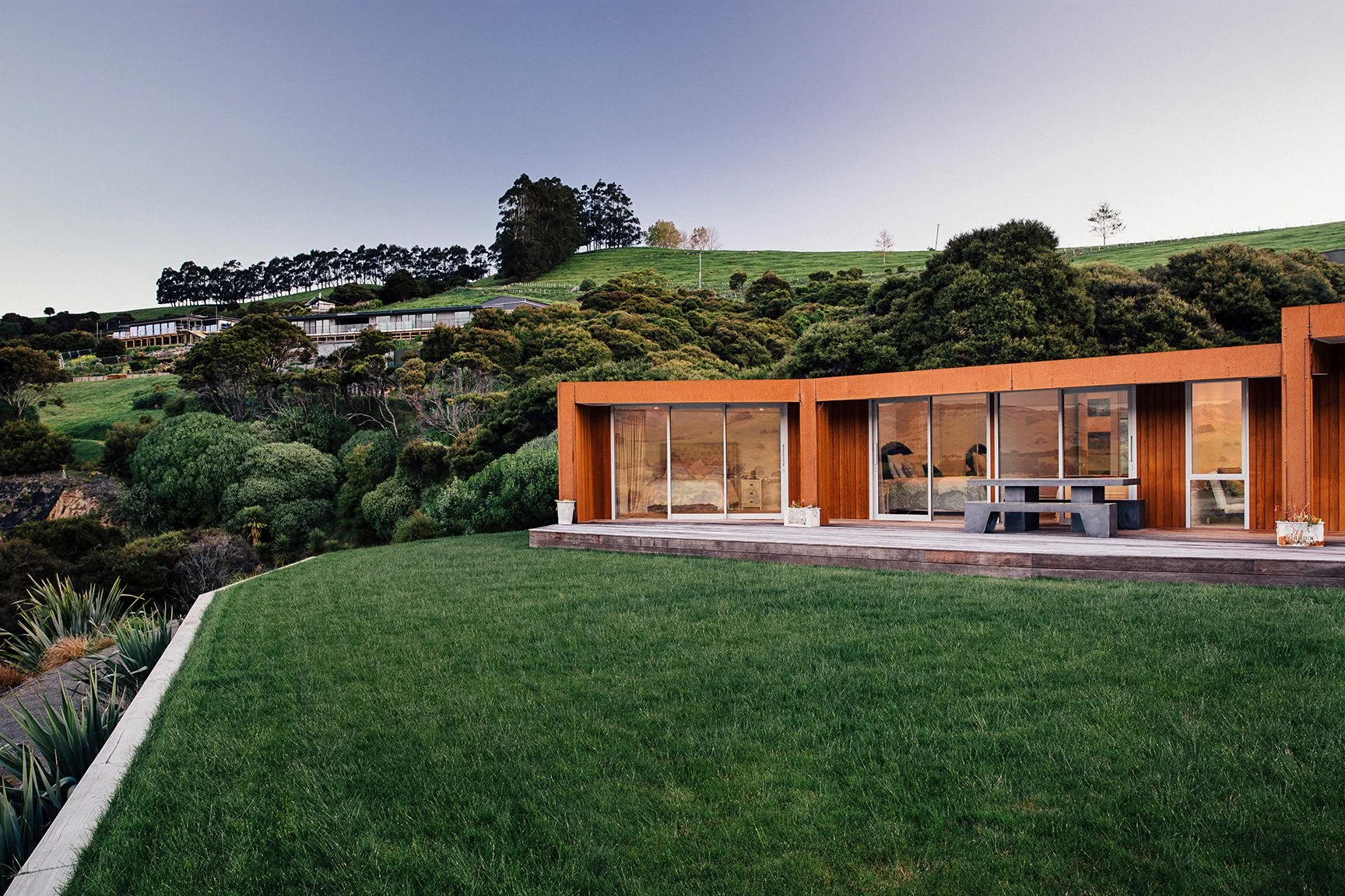 Akaroa Volcanic Ridge House – angular cedar and corten home overlooking Banks Peninsula by AW Architects (2014)