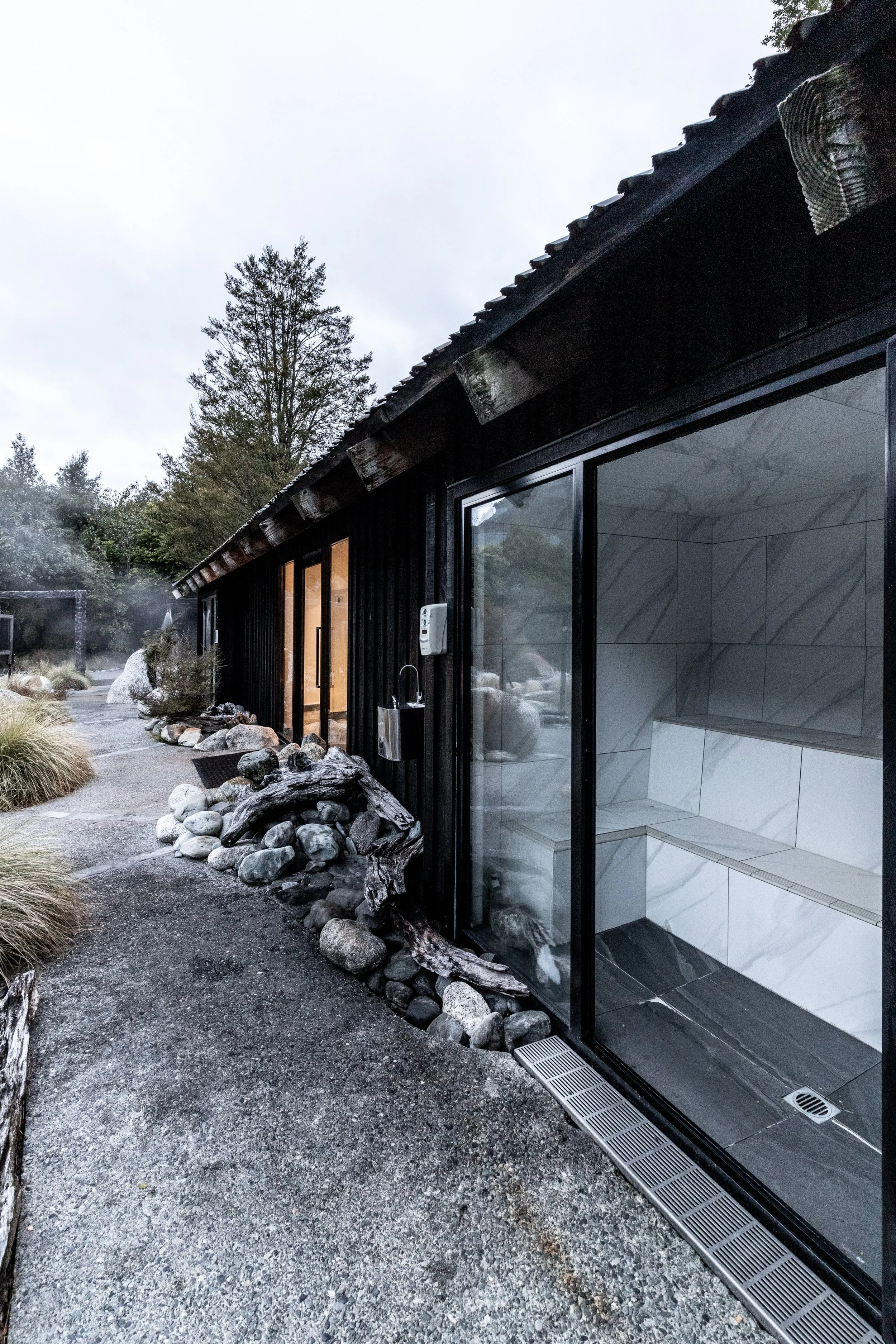 Maruia Hot Springs – alpine resort renovation with timber and stone interiors by AW Architects (2017)